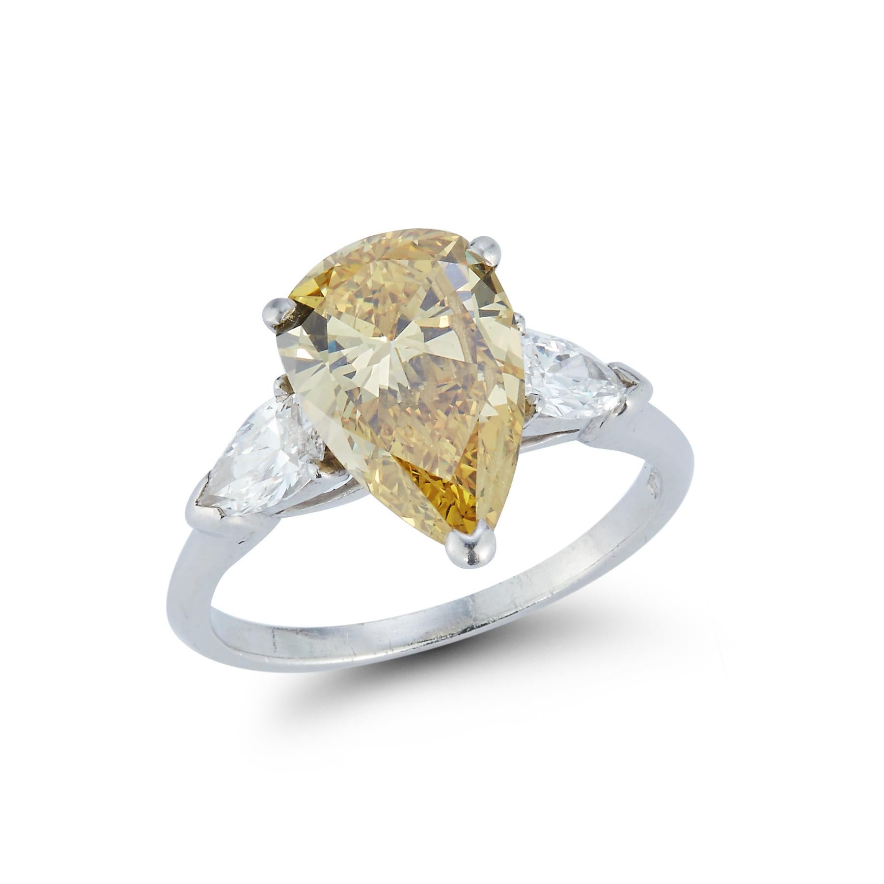 Platinum Engagement Ring with Center Pear Shape diamond weight: 2.96 cts certified by GIA laboratory: Color: fancy deep brownish yellow. Clarity: VS2. Color origin: natural

 2 Side Pear Shaped diamonds approximately .67 cts

Ring Size 6.5