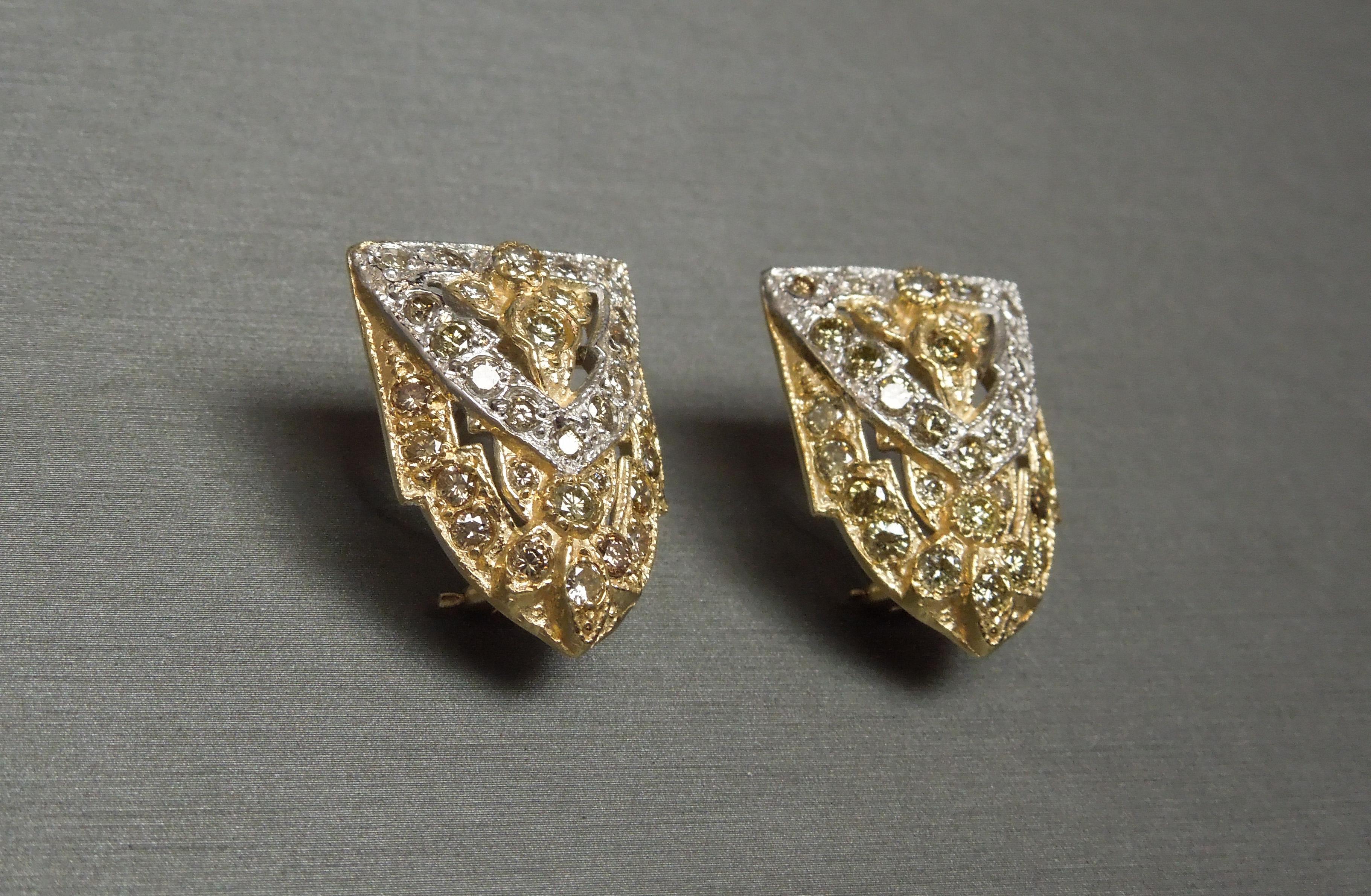 In a Cathedral Art Deco period inspired design, these 14K Diamond Shield Earrings contain a total of 3.85 carats of Nearly Flawless [Natural] Fancy Colored Round Brilliant cuts - consisting of a Green, Cognac & Champagne ranking a VVS2-SI2 Clarity,