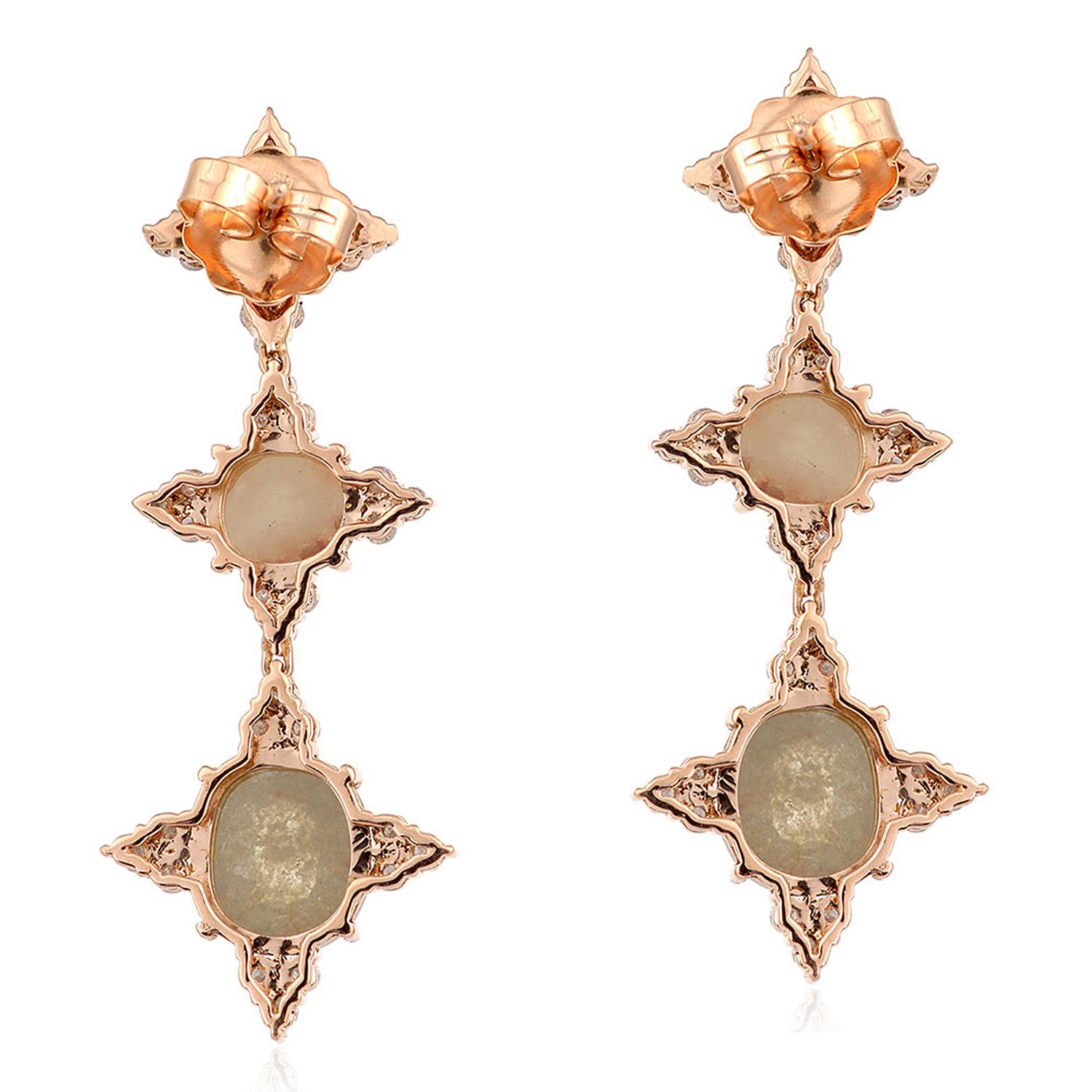 Cast from 18-karat gold, these stunning earrings are hand set with 12.64 carats of fancy natural diamonds. The slice diamonds are covered in a surface of light-reflecting facets, pure raw elegance.

FOLLOW  MEGHNA JEWELS storefront to view the