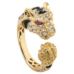Bague tigre en or jaune 18 carats, diamants, onyx et rubis