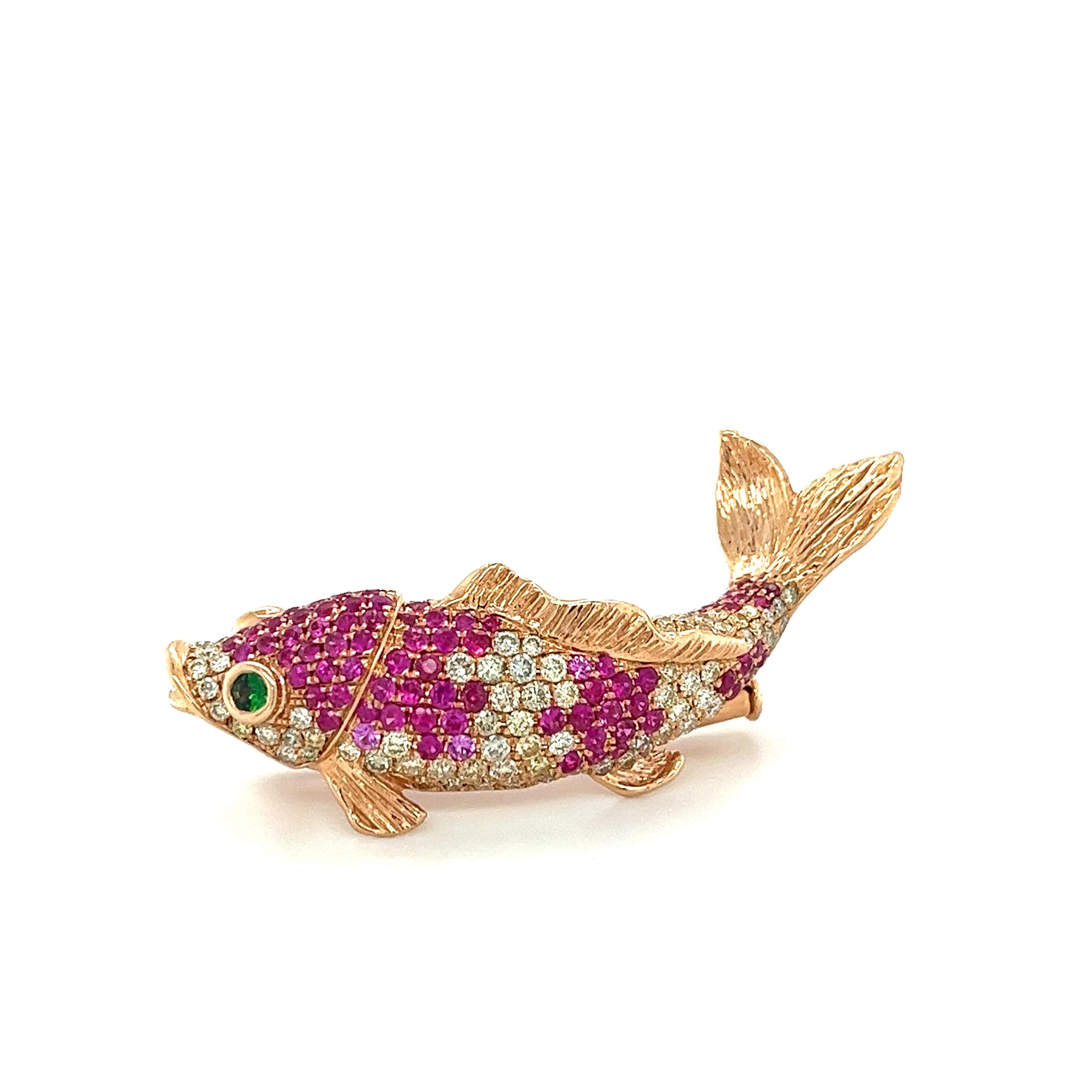 Fancy Diamond & Ruby Fish 18K Rose Gold Brooch

15 Fancy Diamonds 1.53 CT
2 Green Garnet 0.14 CT
6 Pink Sapphires 0.11 CT
105 Rubies 1.56 CT
18K Rose Gold 11.72 GM

The Ruby gemstone is one of the four main precious gemstones. It is a red stone that