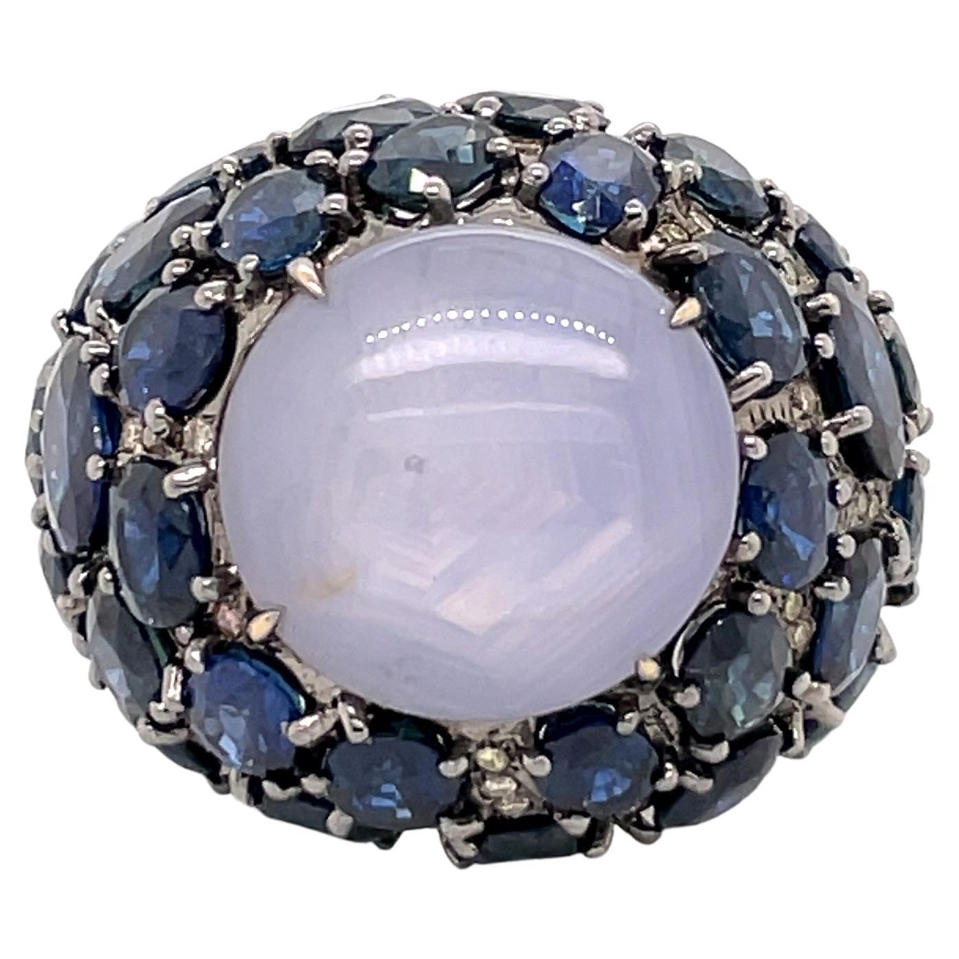 Fancy Diamonds and Sapphire Surrounded Star Sapphire Hues of Blue Ring For Sale