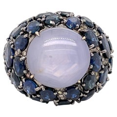 Fancy Diamonds and Sapphire Surrounded Star Sapphire Hues of Blue Ring