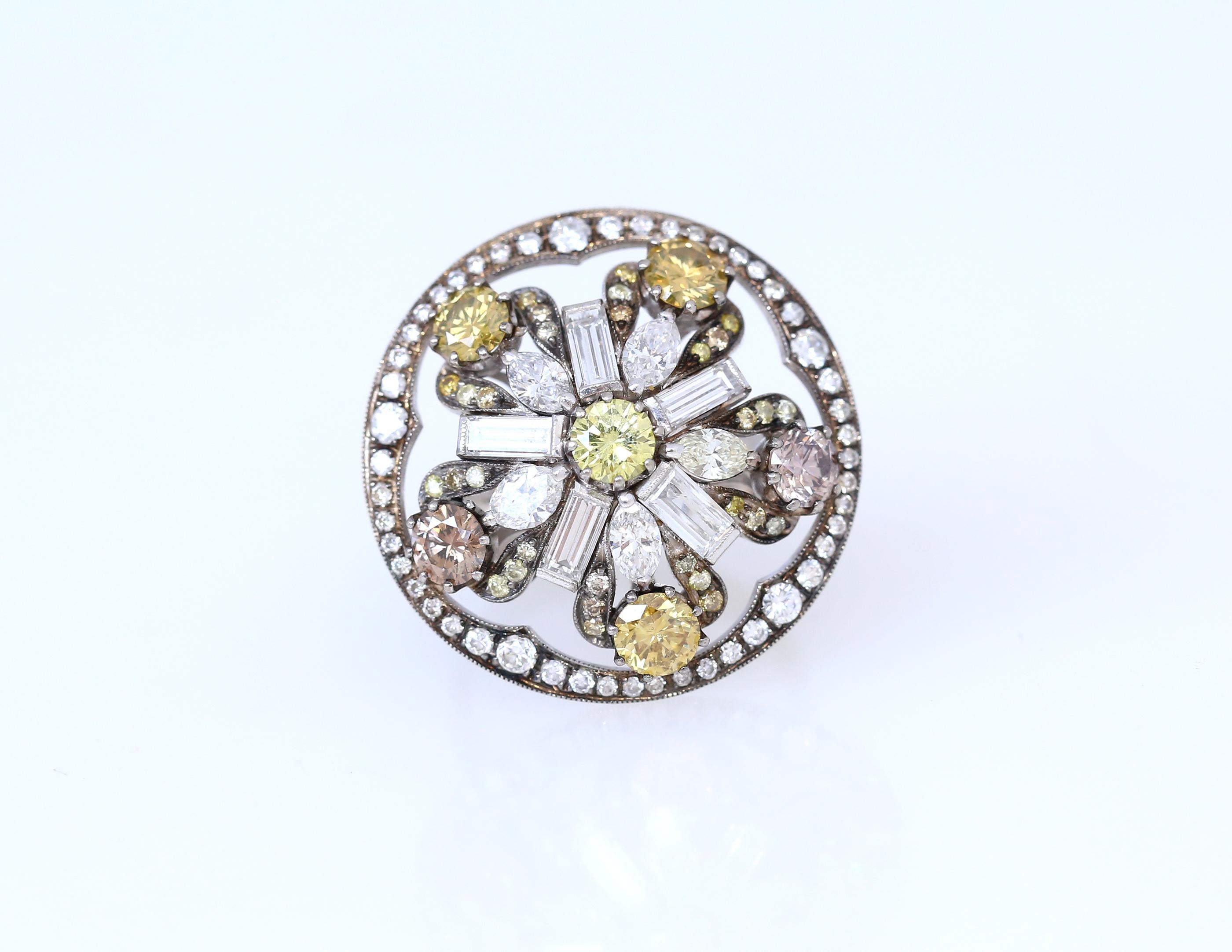 6 Fancy Diamonds of the different color grade Pink Green Light Yellow Light Brown
Each Diamond weighing 0.35Ct. Additional 2.8Ct of Round-cut and Baguette-cut White Diamonds. 
Unusual design, perfect present!
A truly amazing ring for a Diamond