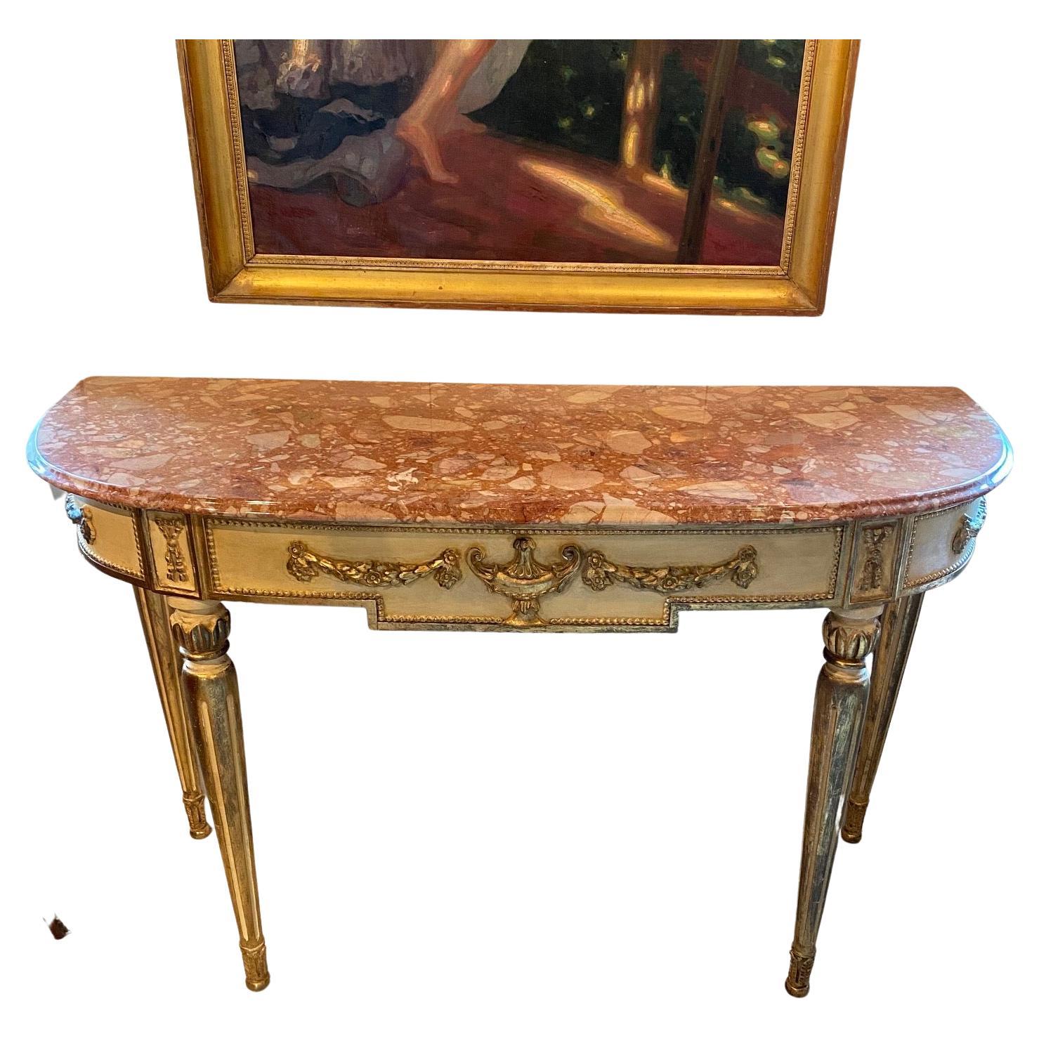 Glamorous antique French Louis XVI fancy painted and gilded demilune shaped console having rouge marble top. #5265.