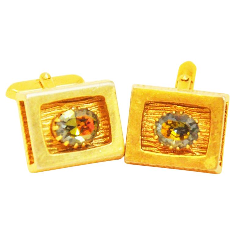 Fancy goldcoloured cufflinks of the sixties with colorful rhinestones For Sale