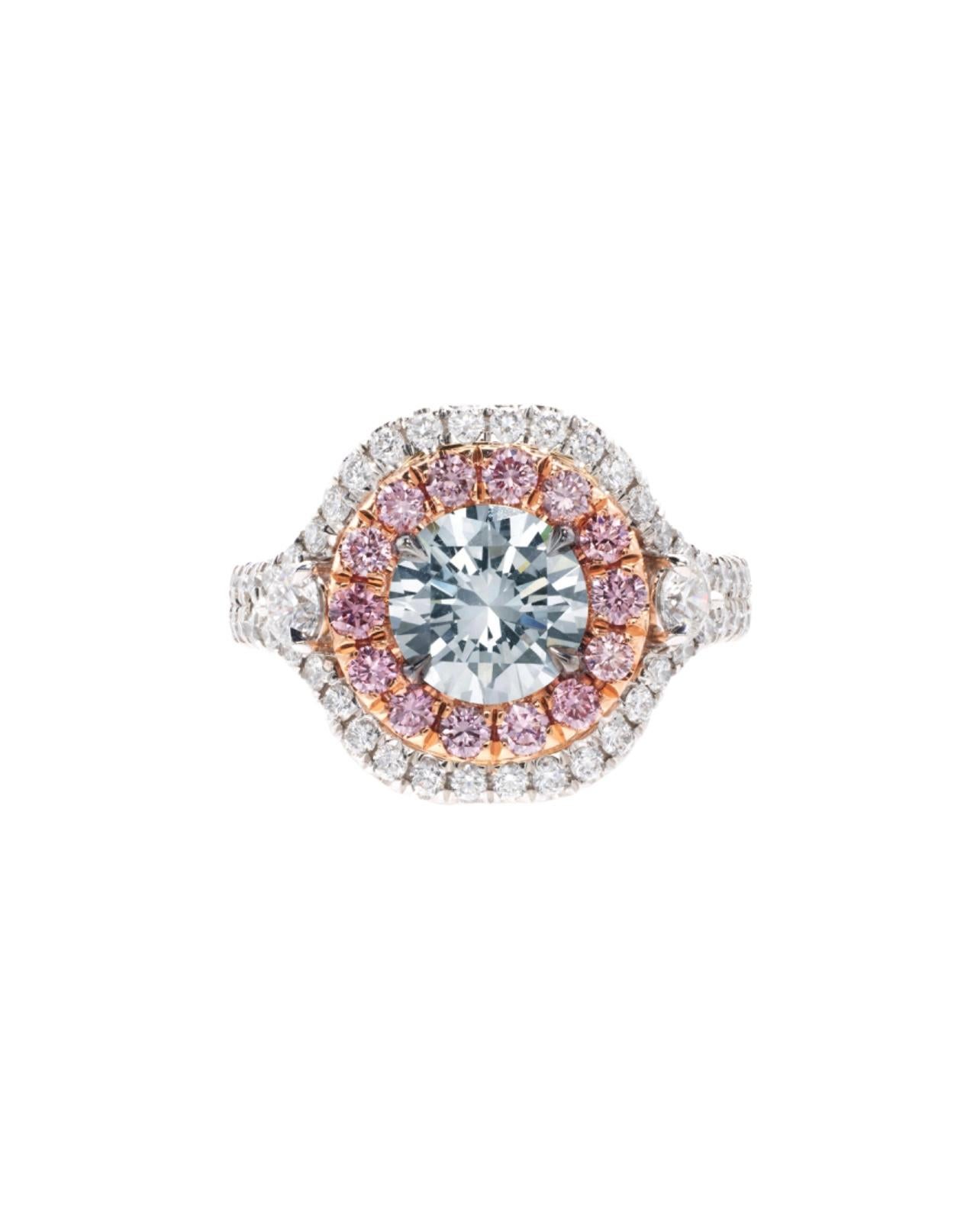 Gorgeous and truly one of a kind GIA certified Fancy gray blue diamond and pink diamond engagement ring beautifully hand made in platinum. 
Centered a Fancy Gray Blue Diamond, surrounded by round brilliant-cut pink diamonds and accented by near-