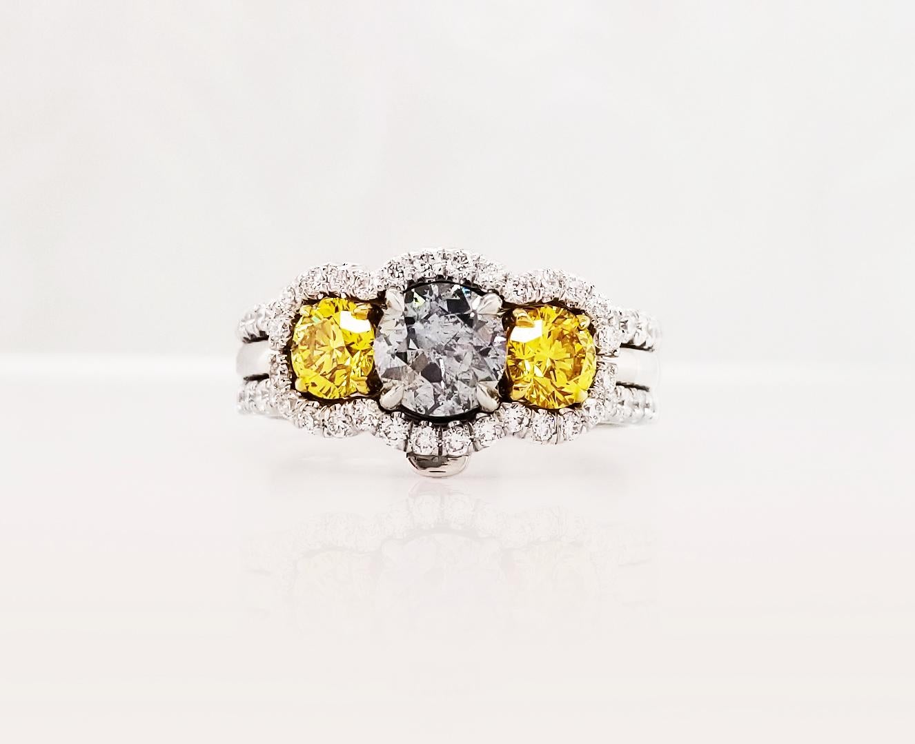 This astonishing Platinum Ring Jacket from Scarselli features a natural 0.69-carat Fancy Gray-Blue round brilliant diamond flanked by two beautiful natural vivid yellow diamonds 0.30 carat each. The two side stones are GIA certified (see Certificate