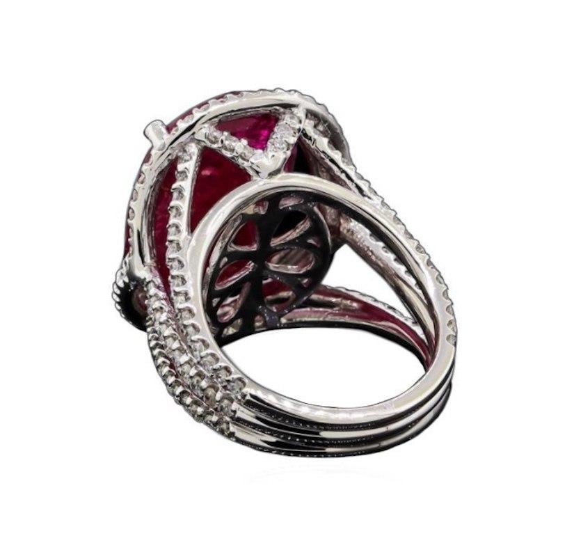 14KT white gold Ruby Diamond ring. 

Natural ruby 12.23ct (18.62 x 12.93 x 4.73mm).
GIA Laboratory, Report #5172603379. 
Eighty prong set round brilliant cut diamonds, measuring 1.45 - 1.35 x 0.87mm. Total weight of 80 Stones = 0.81ct. Clarity SI-1