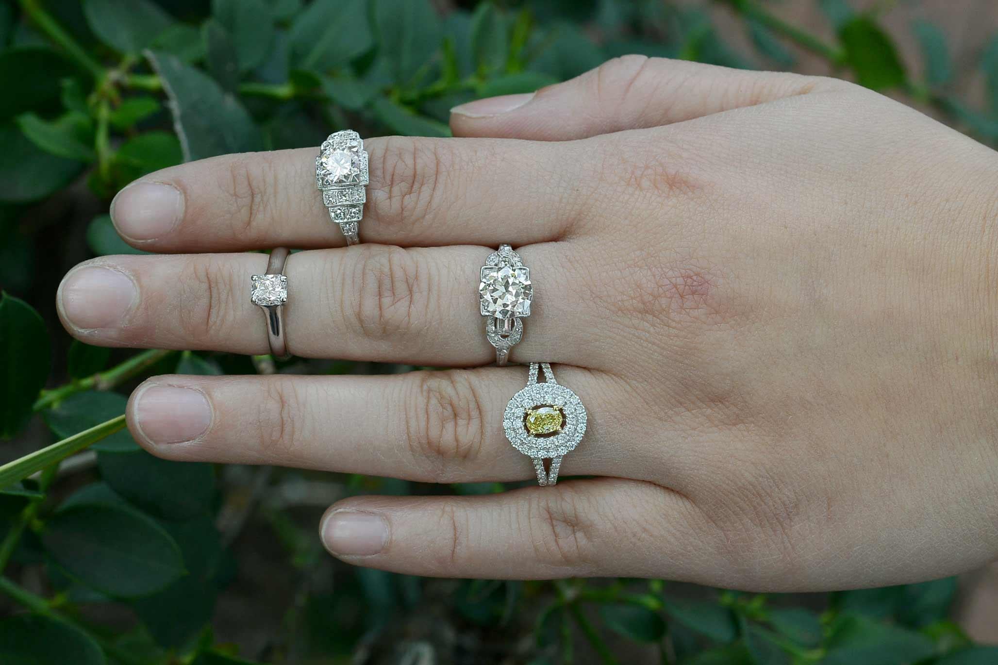 A delightful halo of brilliant white pave' set diamonds encircles an amazing oval diamond of fancy intense yellow. A size 7 1/4 engagement ring with a great amount of knuckle-coverage, would make for a stunning cocktail or statement ring. At 1.21