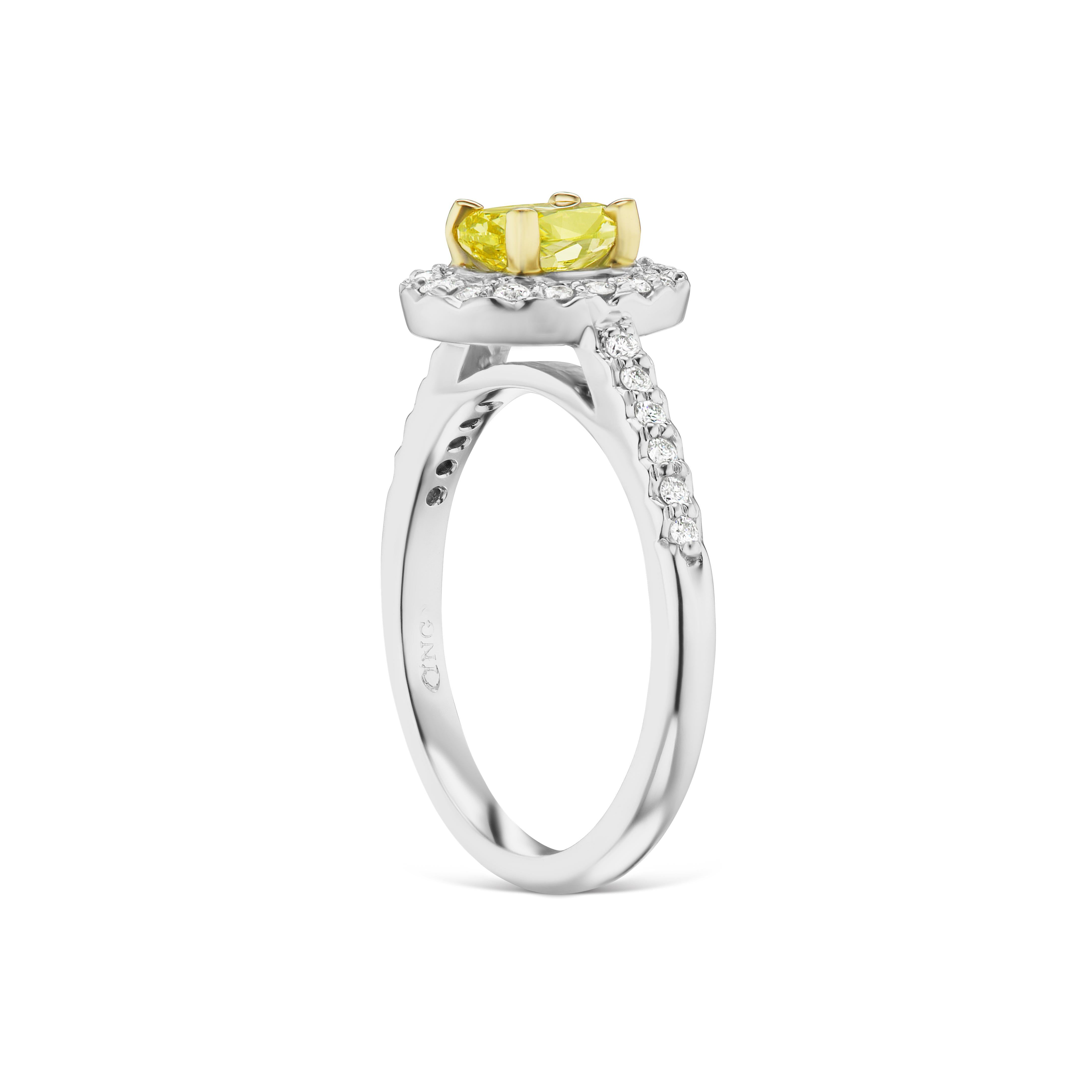 This Fancy Intense Greenish-Yellow .77ct. VS2 Oval Diamond is like a burst of sunshine! It's set in a 14kt. two-tone halo setting with another .27ct. total weight of FVS diamonds. If you don't see something, say something! We would be happy to work