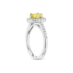 Fancy Intense Greenish-Yellow .77ct. conflict free Oval GIA Cert. Diamond Halo