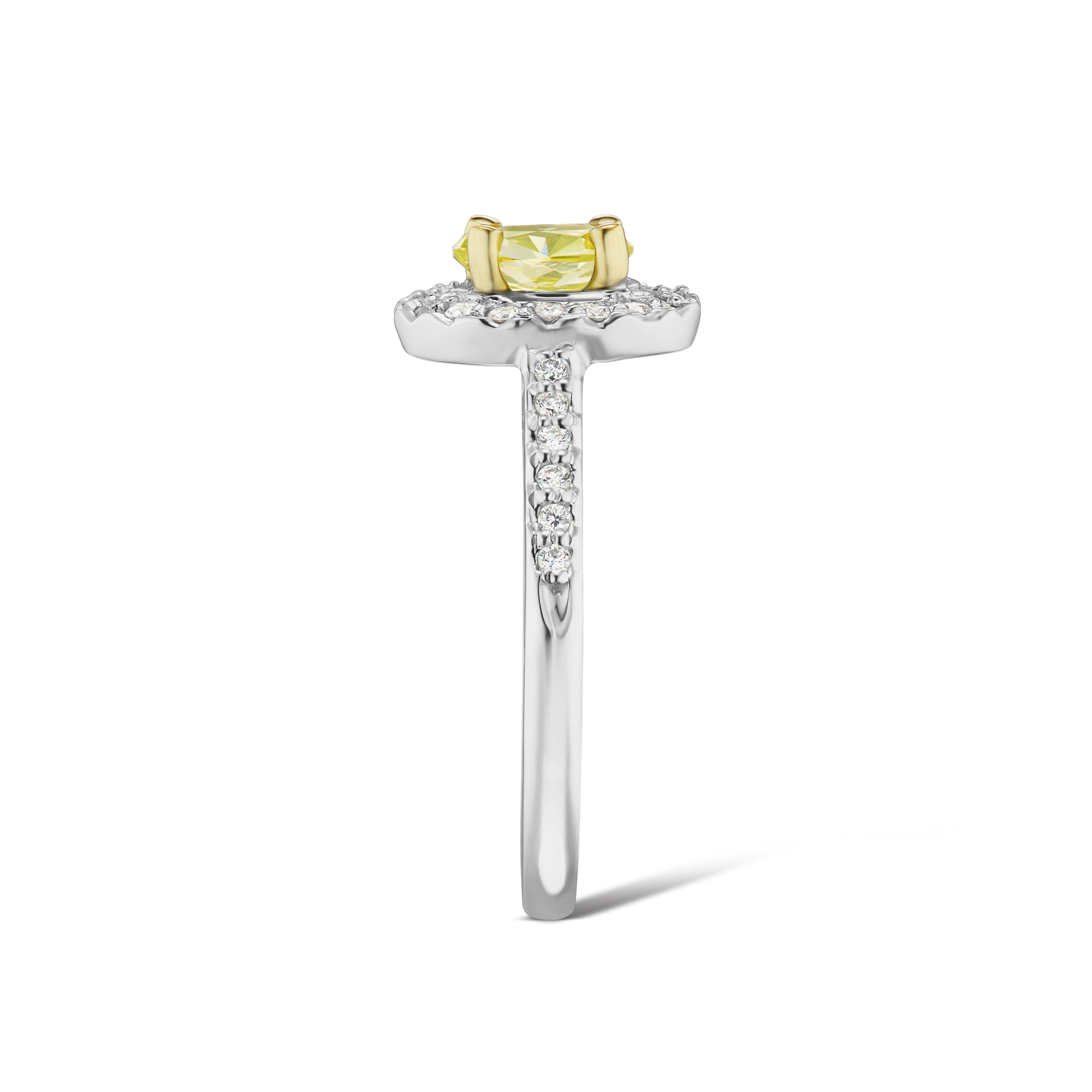 Contemporary Fancy Intense Greenish-Yellow .77ct. conflict free Oval GIA Cert. Diamond Halo For Sale