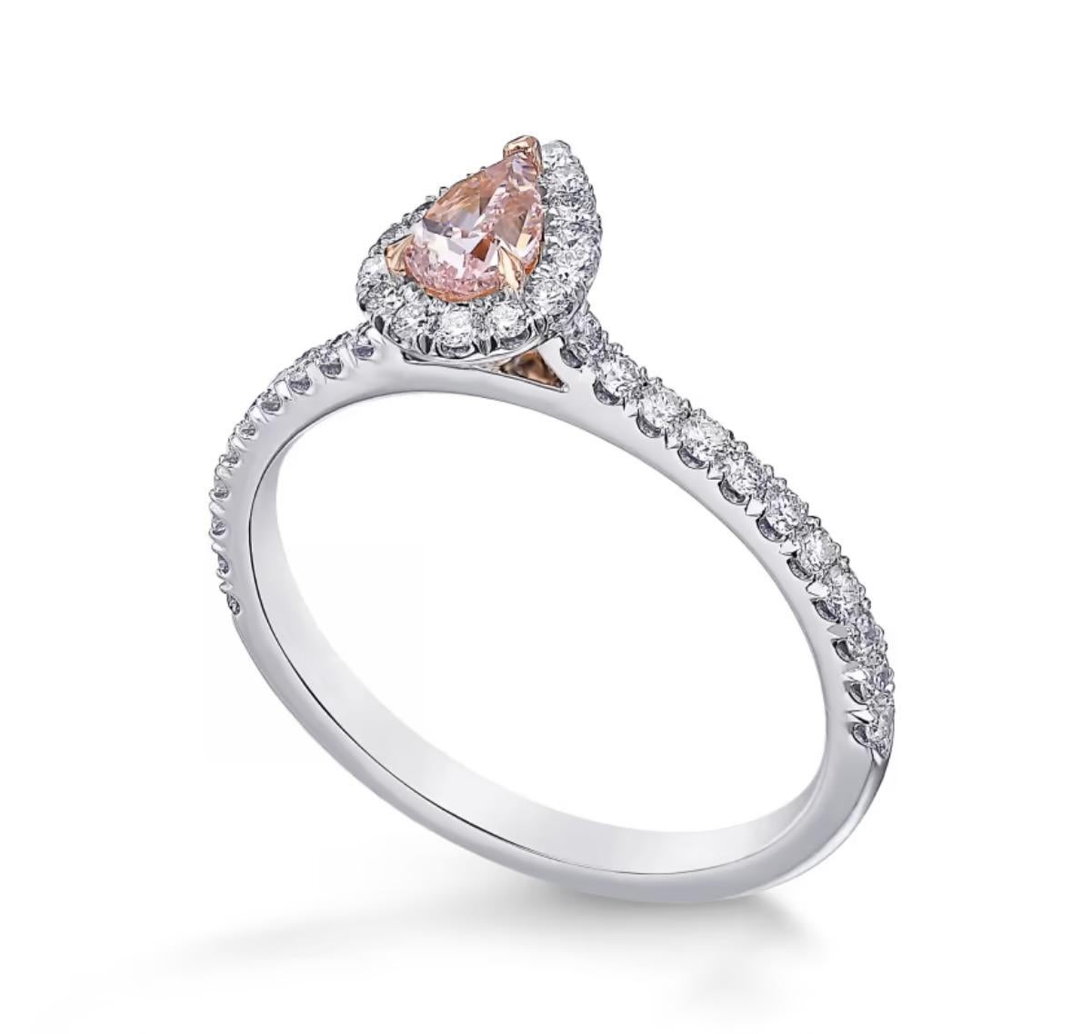Fancy Intense Pink Natural Diamond 0.36 carat Pear shape. I2 clarity. 
According Gia certificate 15830774.
Centering white diamond on white 18K gold ring.

Fancy Intense Pink Natural Diamond 
Dimensions: 6.29 x 4.21 x 2.28 mm.

Can be size upon