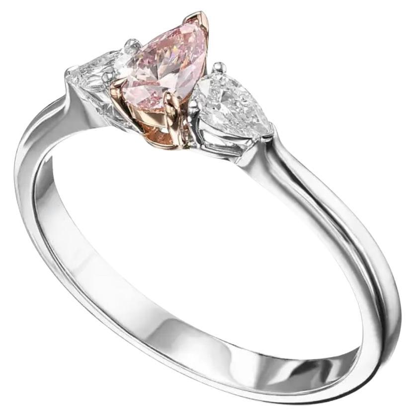 Fancy Intense Pink Natural Diamond 0.36 carat Pear shape. I2 clarity. 
According Gia certificate 15830774.
Centering white diamond on white 18K gold ring.

Fancy Intense Pink Natural Diamond 
Dimensions: 6.29 x 4.21 x 2.28 mm.

Can be size upon