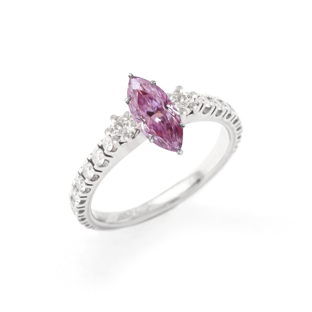Fancy Intense Pink Purple Natural Diamond 0.32 carat Marquise cut. I1 clarity. No fluorescence. 
According Gia certificate 15830674.
Centering white diamond on white 18K gold ring.

Fancy Intense Pink Purple Natural Diamond Dimensions: 7.25 x 3.31 x