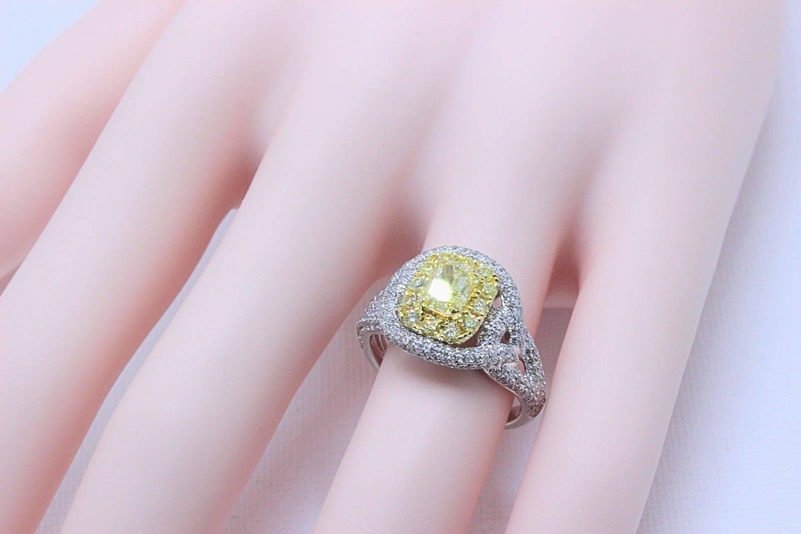 Fancy Intense Yellow Diamond Engagement Ring with Pave Diamond Accents
Certification:  GIA 2176961142
Metal:  Platinum PT950 & Yellow Gold 18KT
Size:  7.5 - Sizable
Total Carat Weight:  2.33 TCW
Center Diamond Shape:  Radiant ( Round-Cornered