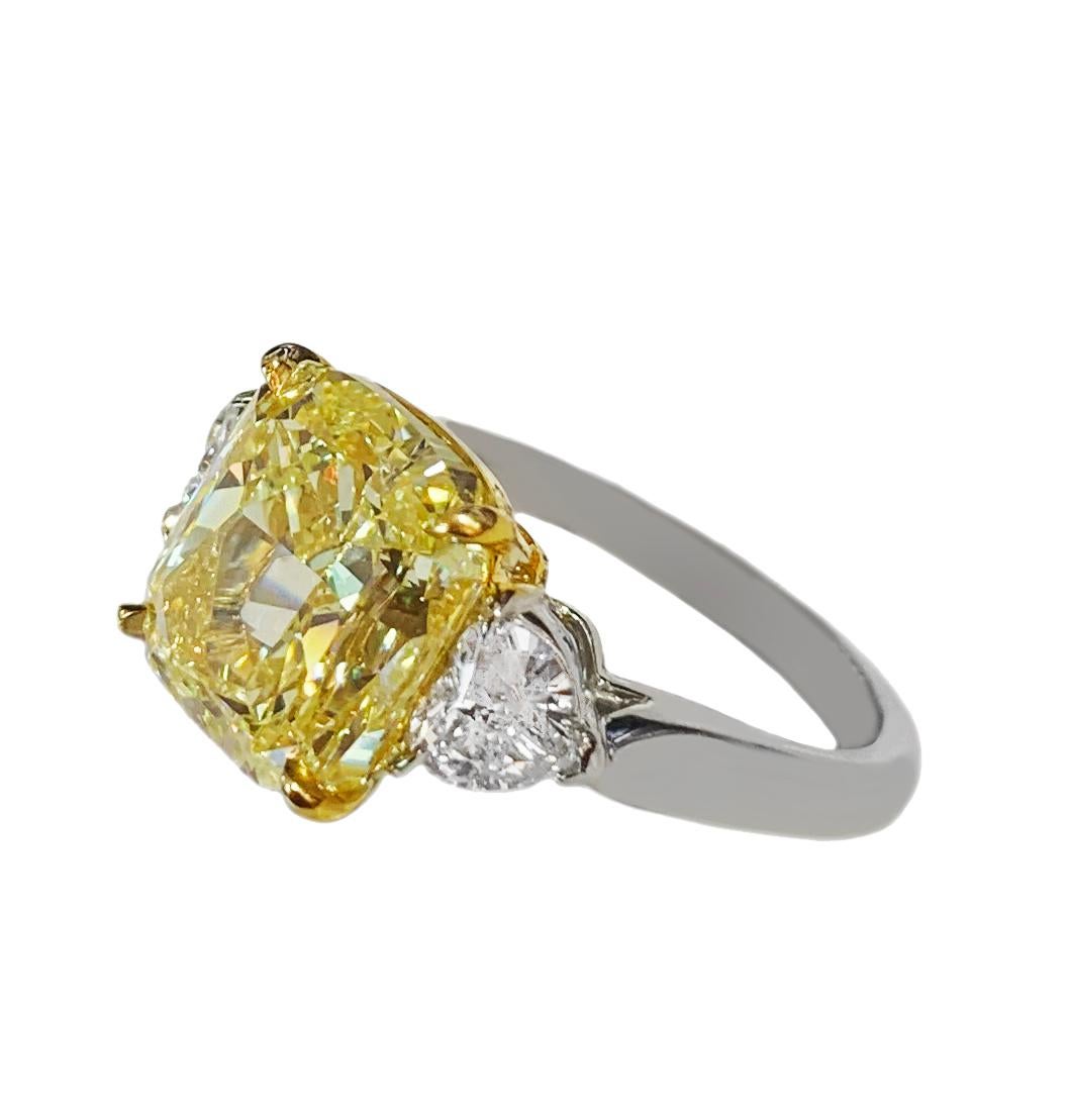-14k White Gold
-Ring size:6
-Fancy Intense Yellow Diamond: 5.82ct, dimension: 10.44x9.76mm
-Clarity: VS2
-White Diamonds: 0.7ct, VVS/ E-F