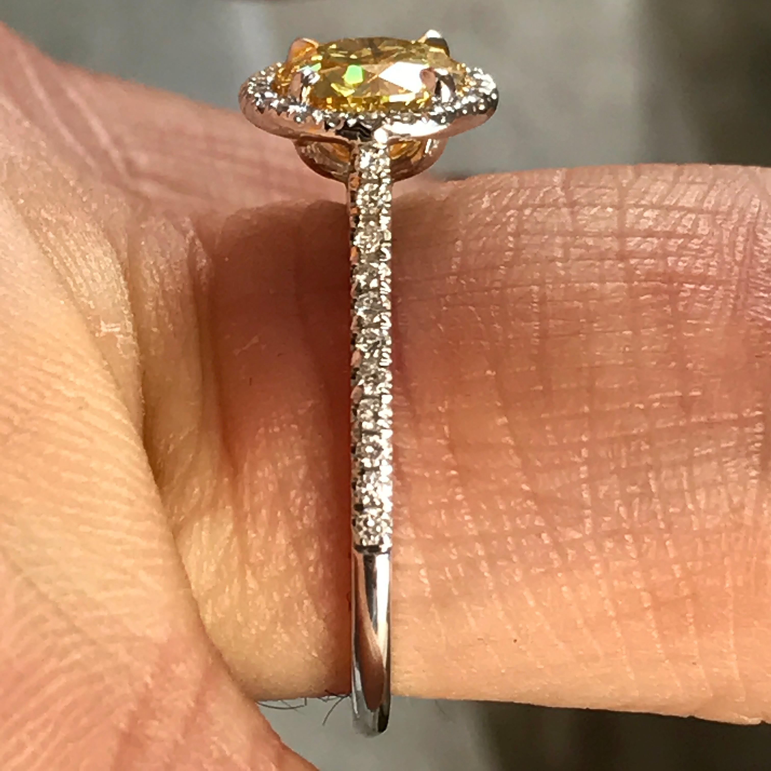 Contemporary Fancy Intense Yellow Diamond Engagement Ring 1.02 GIA Certified Diamond Halo For Sale