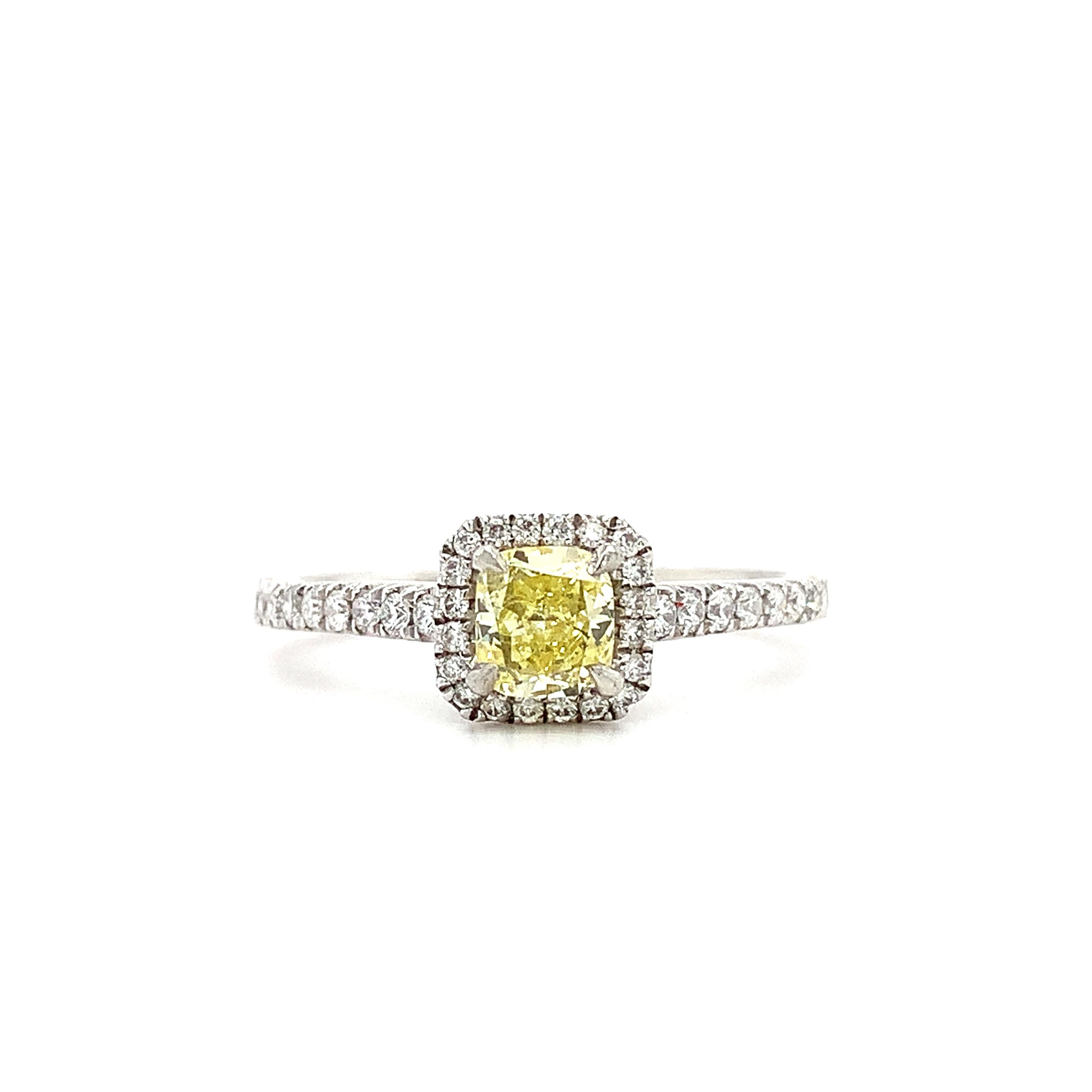 Modern Fancy intense yellow diamond halo engagement ring platinum For Sale