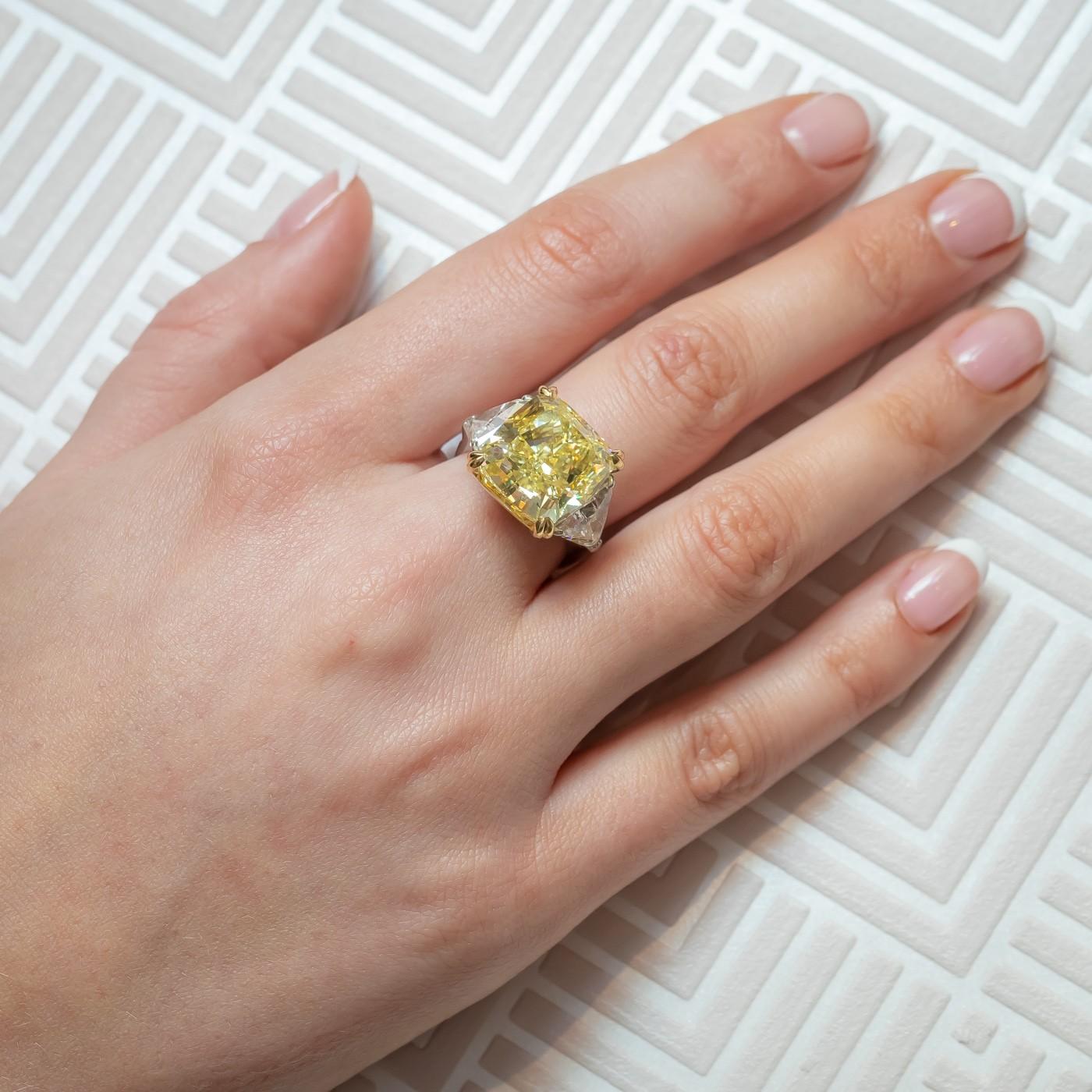 A yellow diamond ring, set with a 14.51ct fancy intense yellow colour, VS1 clarity, cushion shaped, modified brilliant-cut diamond, measuring 13.45 x 13.01 x 9.00mm, accompanied by GIA certificate 14450855, in a four claw, yellow gold setting,