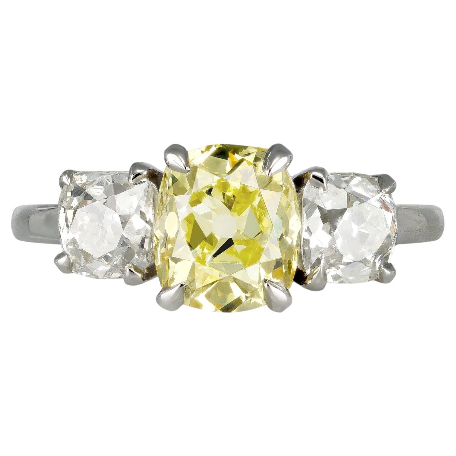 Fancy intense yellow diamond three stone ring, circa 1920. For Sale