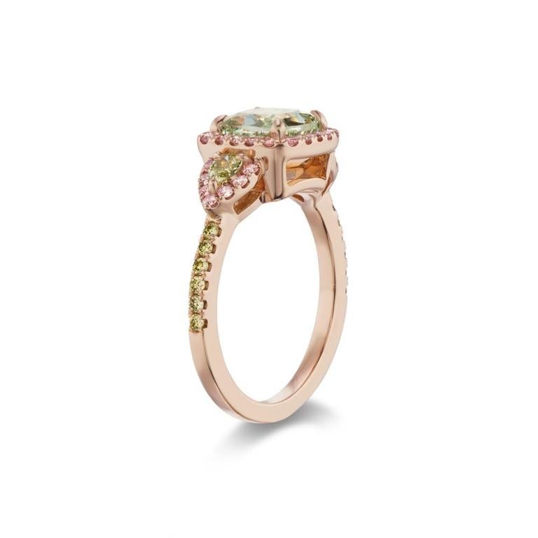 FANCY INTENSE YELLOW GREEN DIAMOND RING A beautiful and rare GIA certified fancy intense yellowish Green diamond is embraced by fancy intense pink diamond halos and intense greens on the shank. 2 fancy intense matching greens make a remarkable and