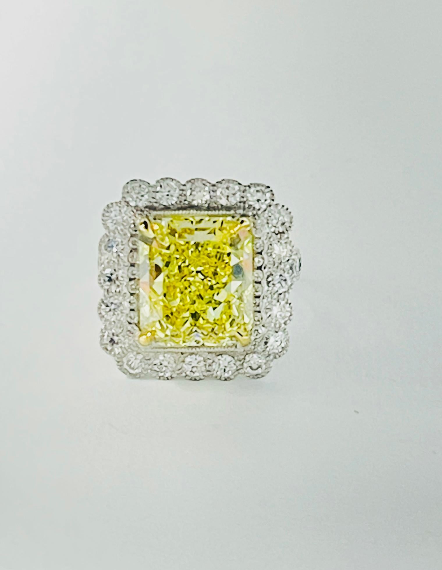 Contemporary Fancy Intense Yellow Radiant Diamond And White Diamond Engagement Ring, GIA For Sale