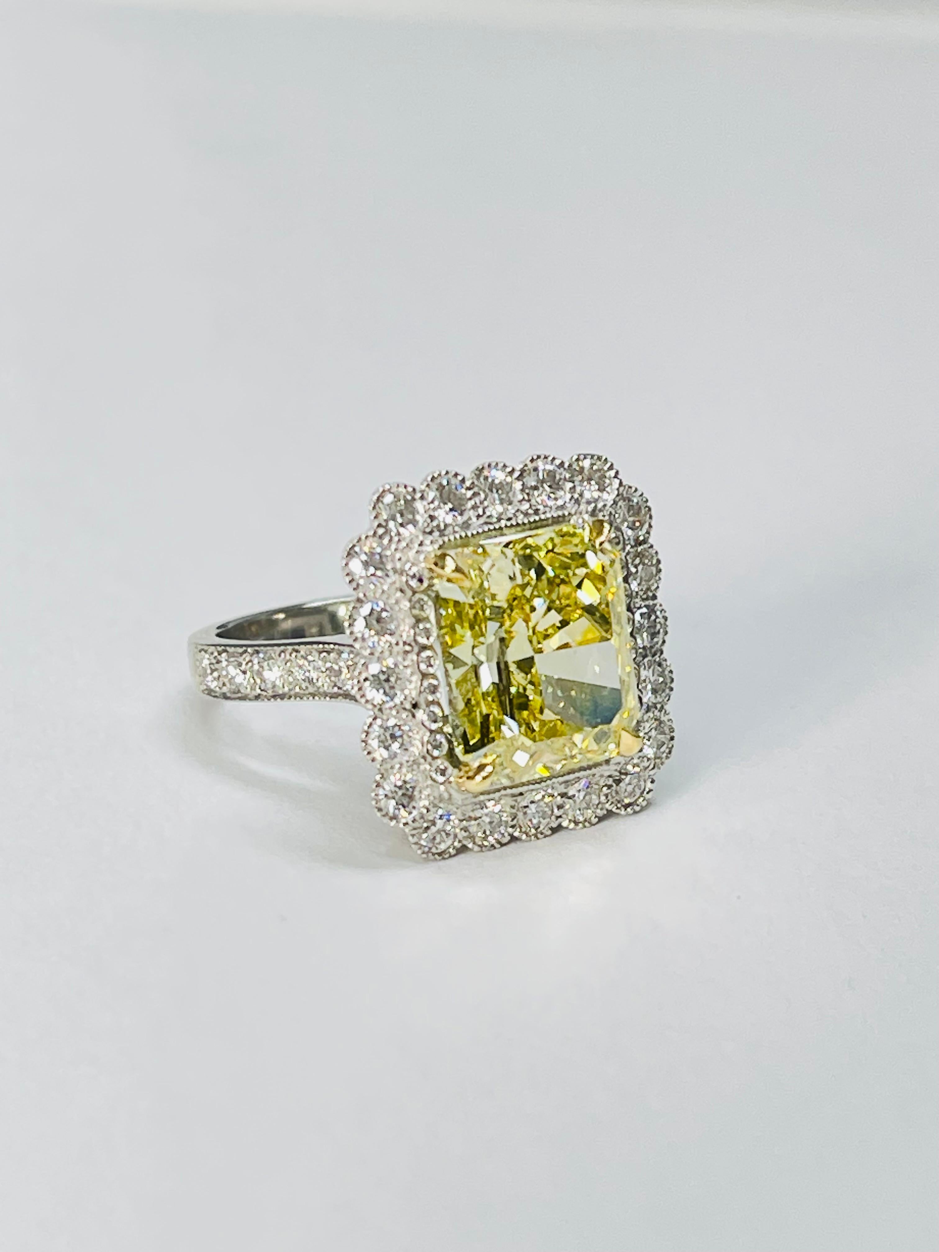 Radiant Cut Fancy Intense Yellow Radiant Diamond And White Diamond Engagement Ring, GIA For Sale