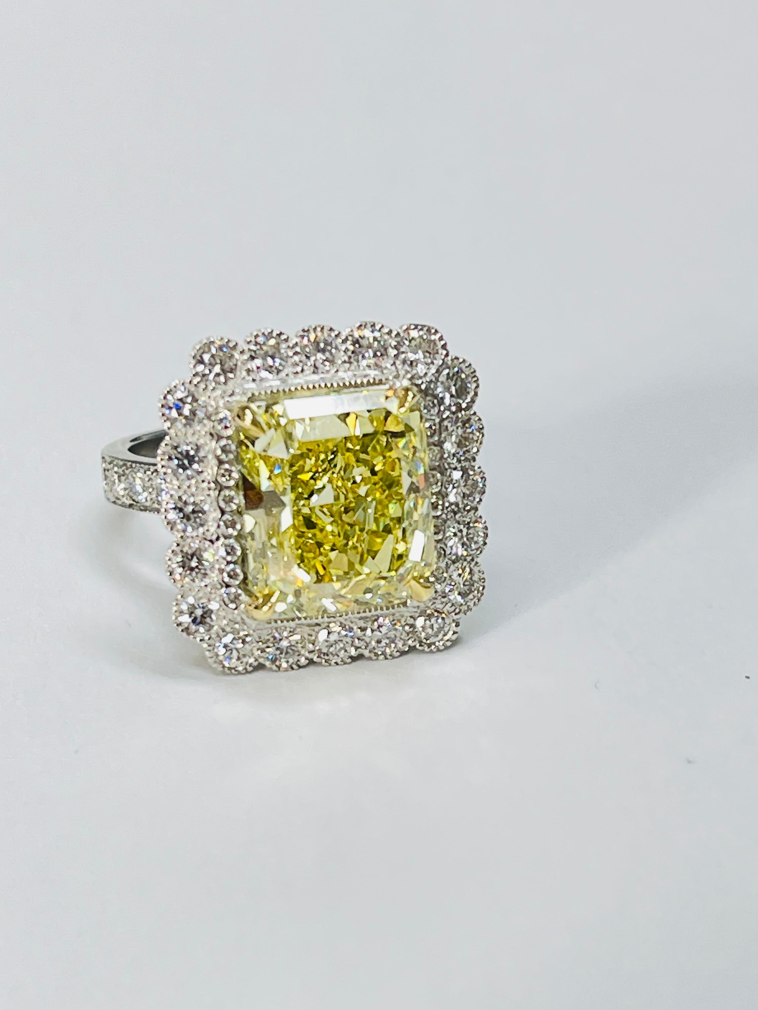 Fancy Intense Yellow Radiant Diamond And White Diamond Engagement Ring, GIA In New Condition For Sale In New York, NY