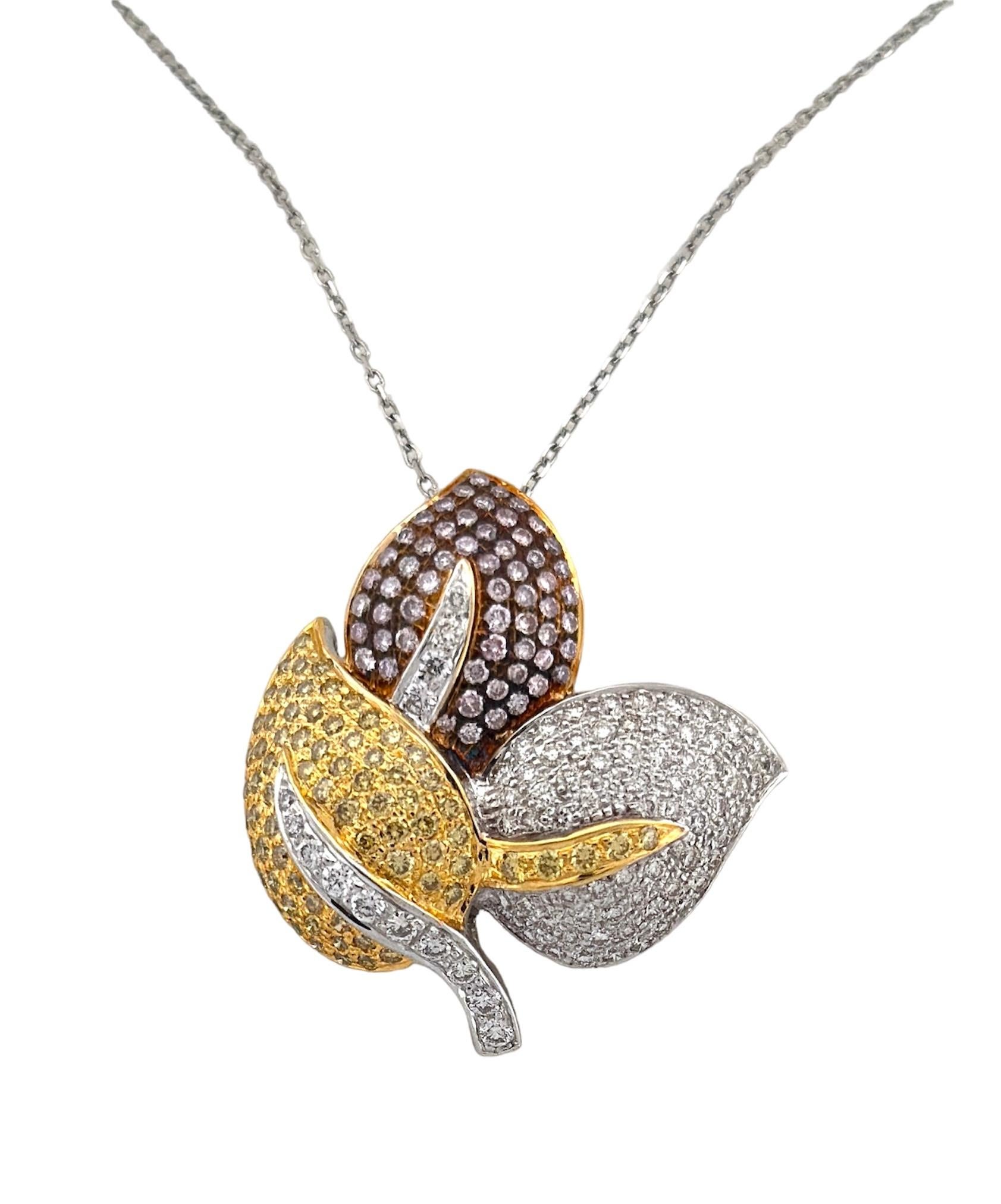 These Yellow, Pink and White Color Diamond Pendant, a product of the year 2001, is a captivating fusion of sophistication and nature-inspired design. With a total diamond weight of 1.99 carats, this pendant exhibits a beautiful harmony between the