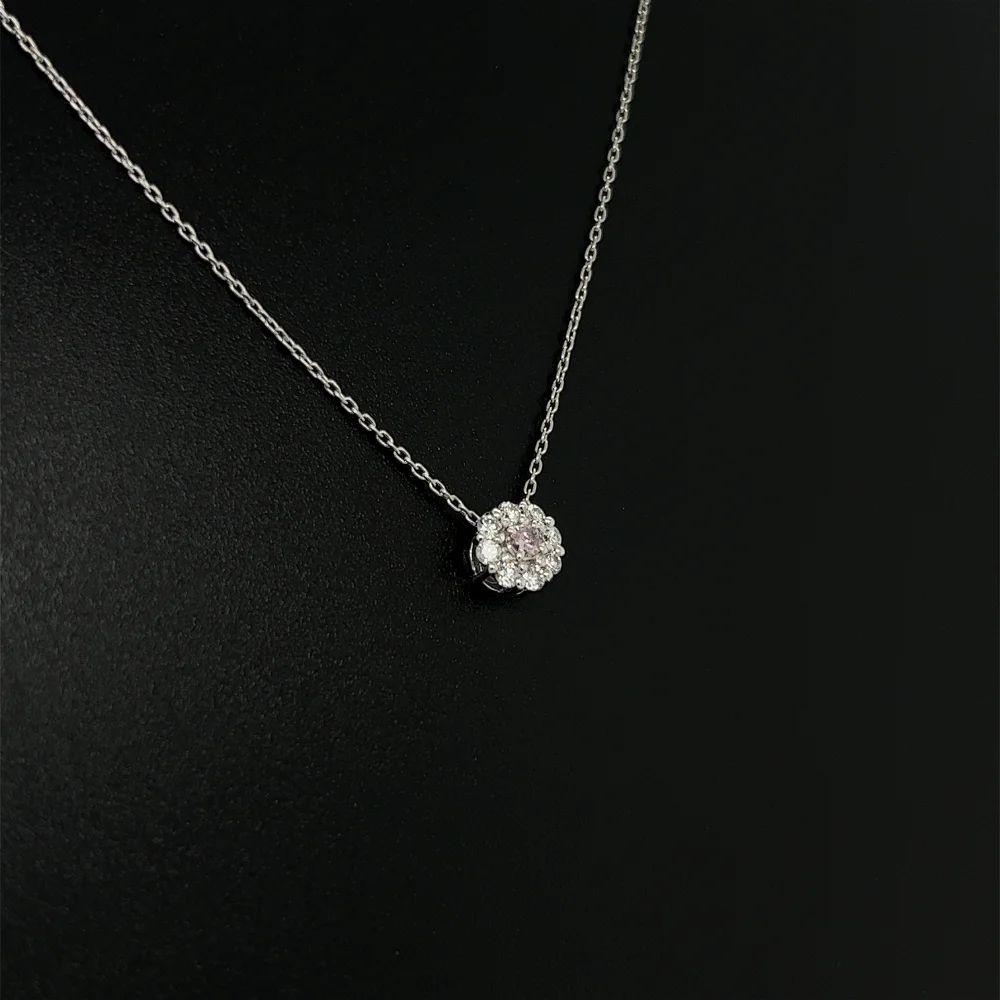 Simply Beautiful! Vintage Diamond Platinum Drop Pendant Necklace. Ssecurely Hand set with 0.04 Carat Fancy Light Purplish Pink Round Diamond and Diamond 0.15tcw. Hand crafted Platinum mounting. Suspended from a 16” Link Chain. More Beautiful in Real