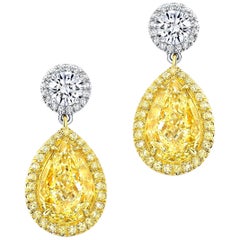 Fancy Light Yellow Diamond Earrings 4.03 Carat Pear Shapes