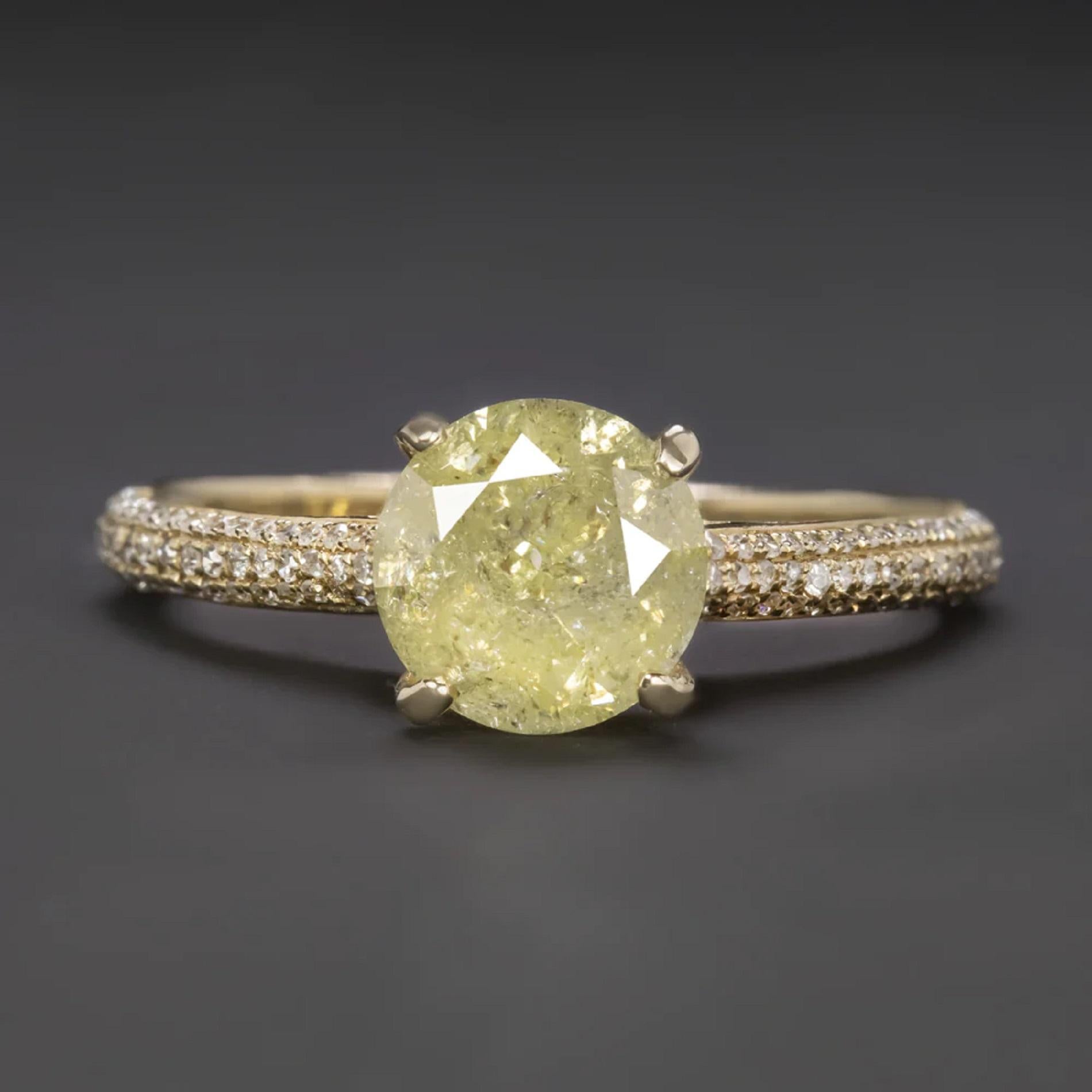 paired with a luxurious diamond encrusted setting!

Highlights:

- Substantial 1.60ct natural diamond center

- Lovely fancy light yellow color.

- White inclusions create a unique rustic look!

- 0.70ct of bright white and vibrant accent diamonds