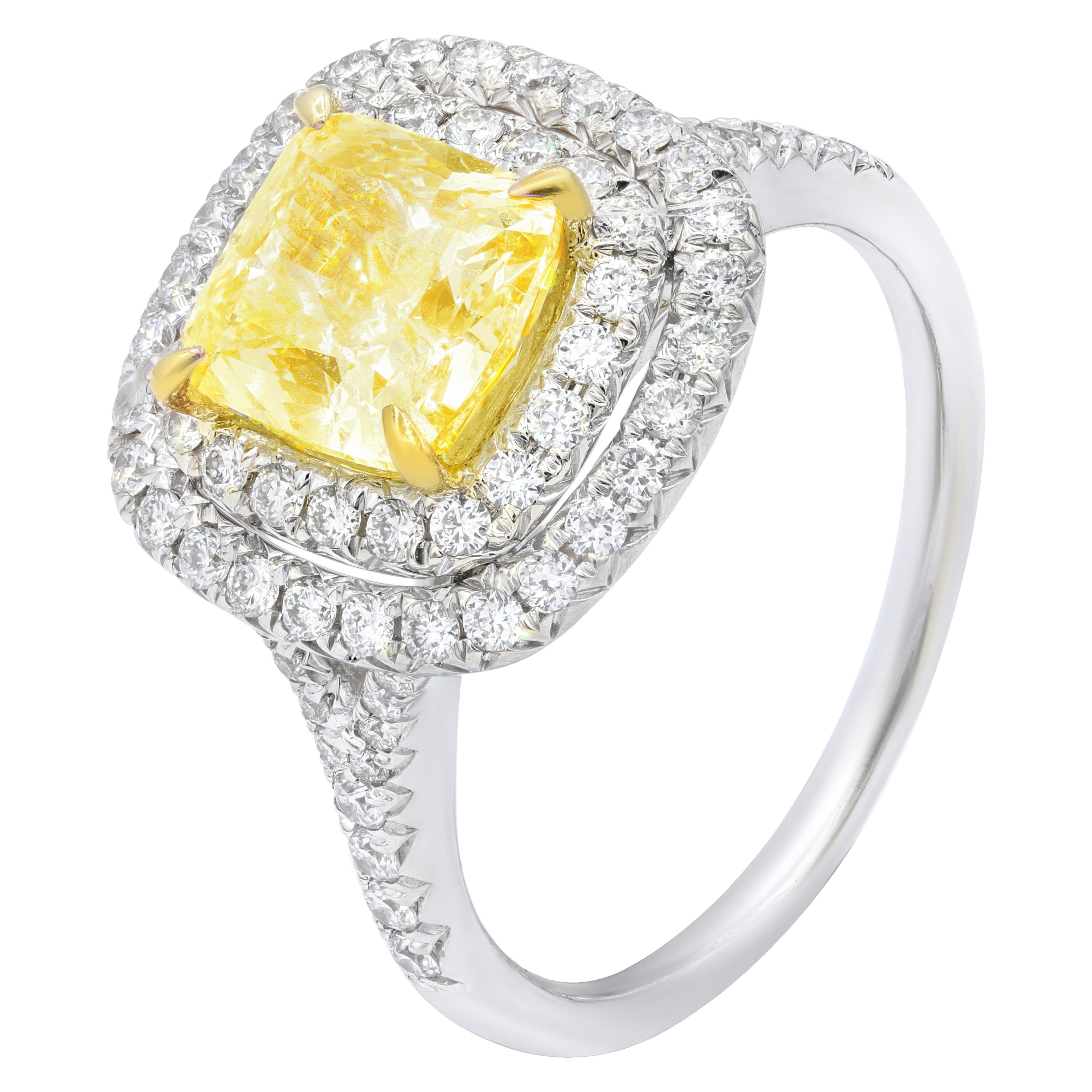 18K White gold fancy light yellow diamond ring with center GIA cushion cut 2.01 ct FLY-VVS2 Set in double halo shank micropave setting 0.65 ct total weight.