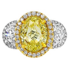Anillo de diamantes ovalado amarillo claro fantasía