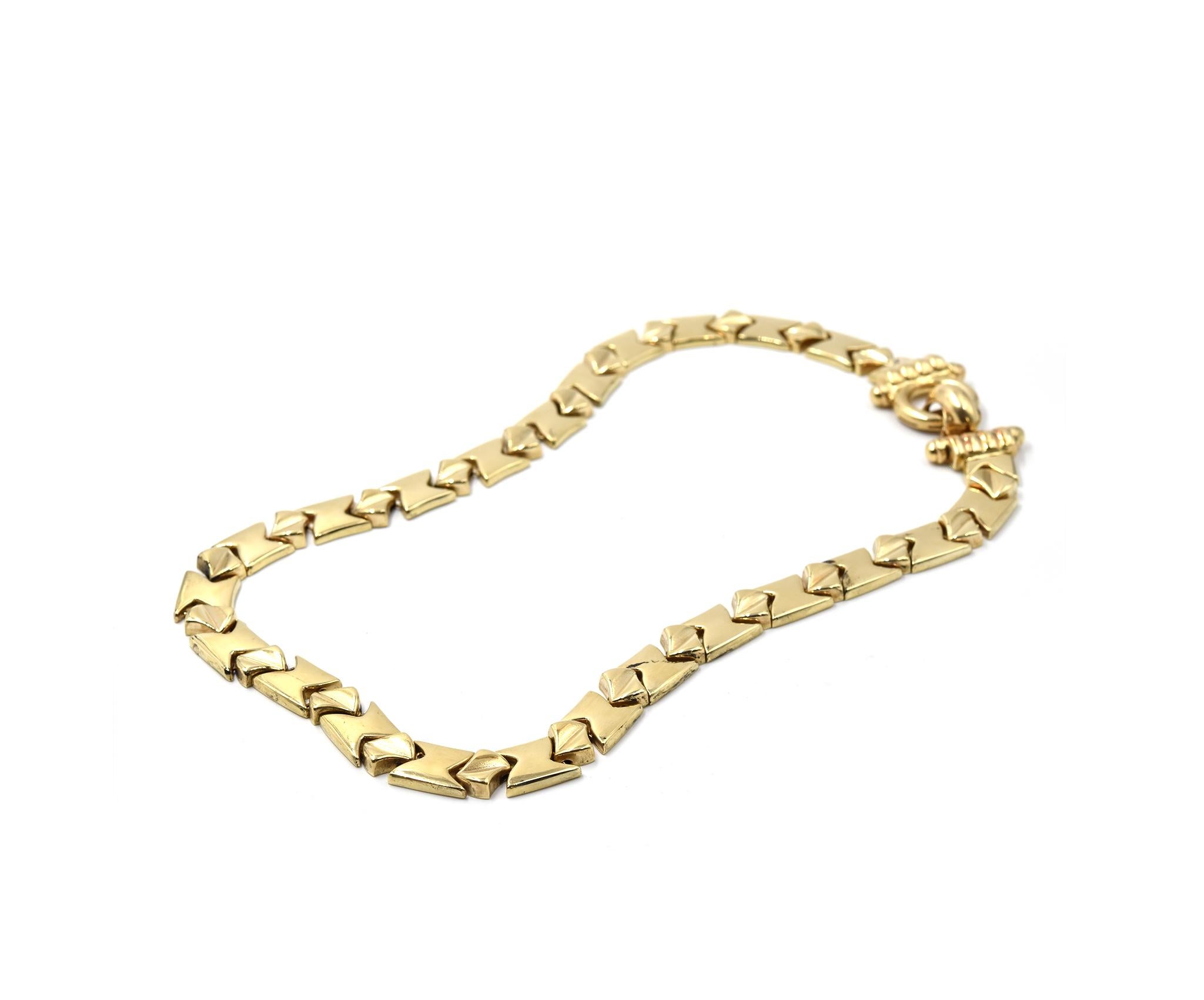 Designer: custom design
Material: 14k yellow gold
Dimensions: necklace is 29-inch long by 1/2-inch wide
Weight: 59.00 grams
