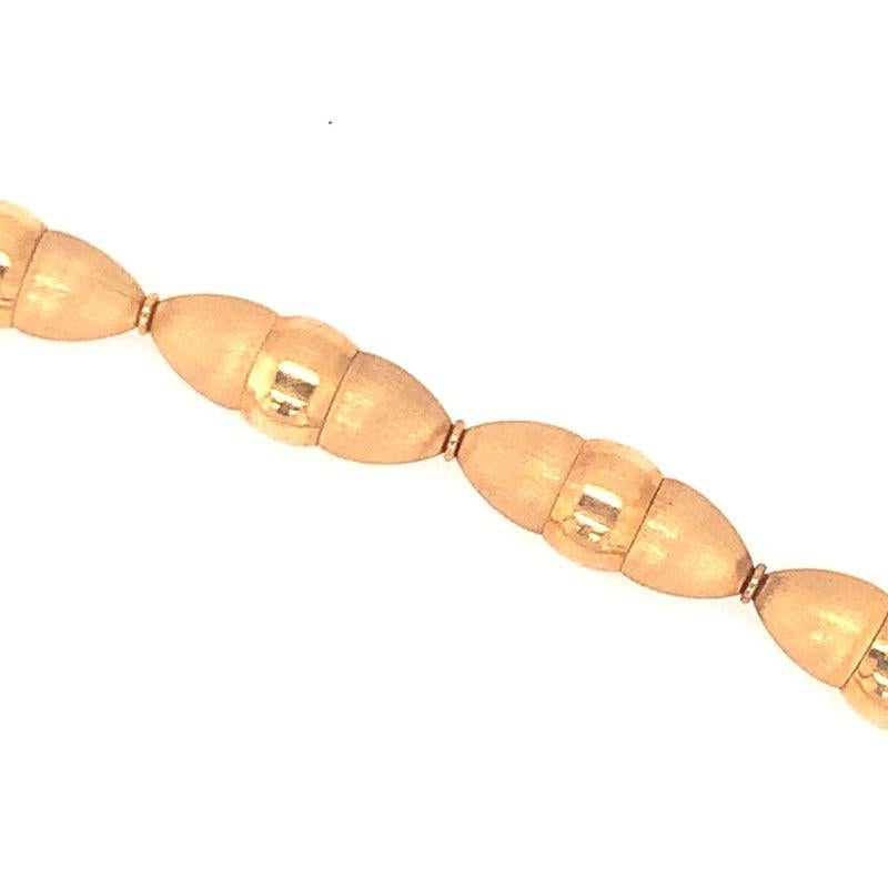 One fancy link 18K yellow gold necklace with textured and high polish gold cylindrical links enhanced by a hidden clasp. With Italian Hallmarks, Circa 1970s.

Versatile, refined, gleaming.

Additional information:
Metal: 18K yellow gold
Circa: