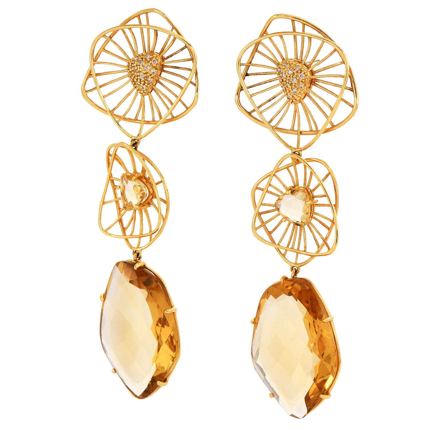 Estate Diamond Citrine 18K Gold Three Drop Dangle Earrings

Very Well made evening wear Art and Crafts Dressy Triangular 3 link drop Earrings crafted in 18K Yellow gold with Natural Round Diamonds and Freeform Rose cut Genuine Citrine gemstone