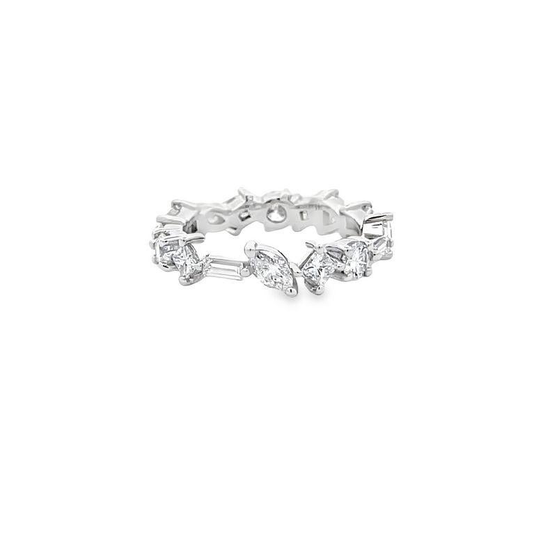 We are thrilled to introduce to you our latest diamond fancy-shape eternity band. This band is unique because of the perfect balance between its different diamond shapes. It has sixteen stones with a color grade of F and a clarity grade of VS. The