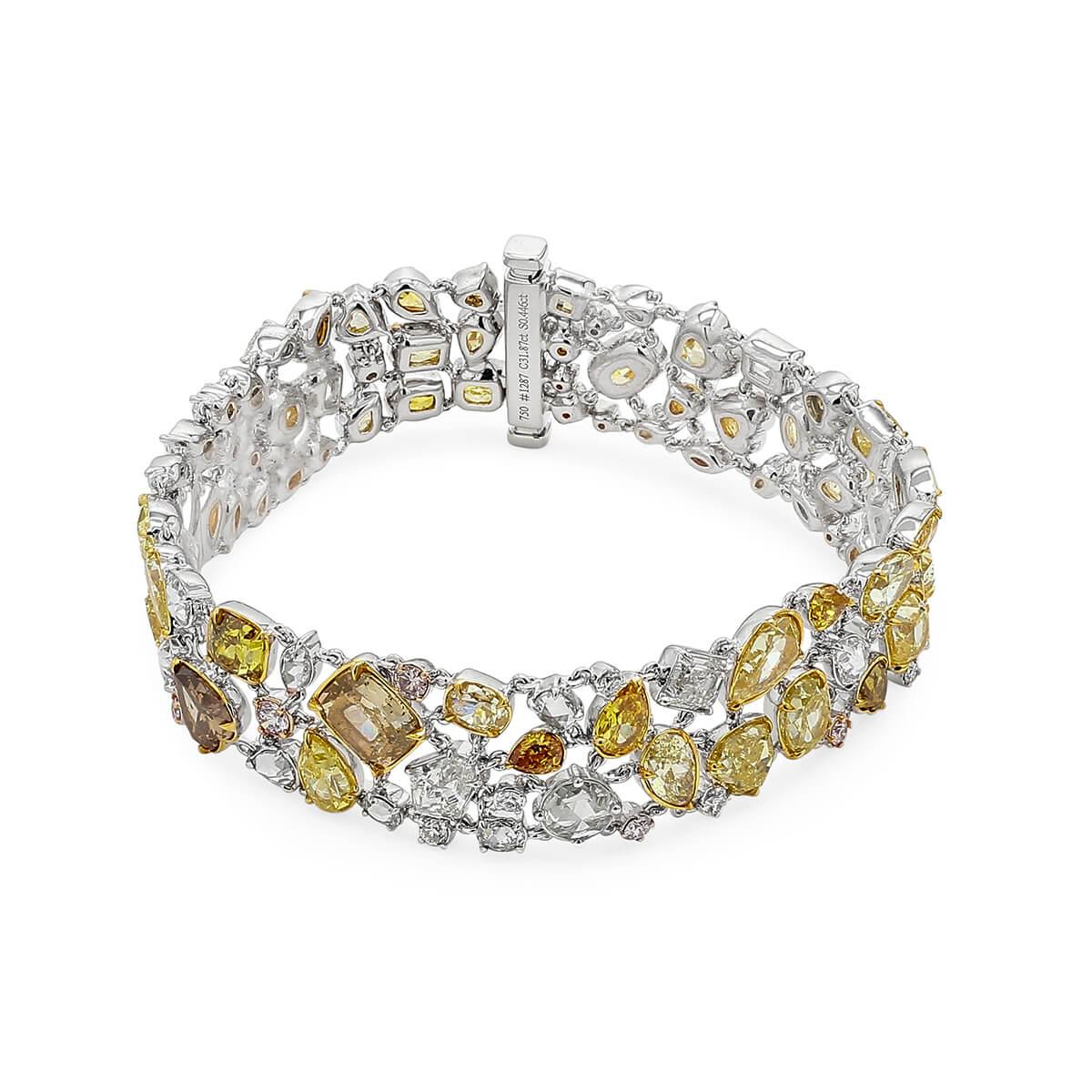 This one of a kind piece is made from natural untreated yellow and white diamonds, perfectly placed in a variety of shapes. Elegant and sophisticated with a bit of colour to stand out. This piece has been expertly crafted using 18 Karat White Gold.