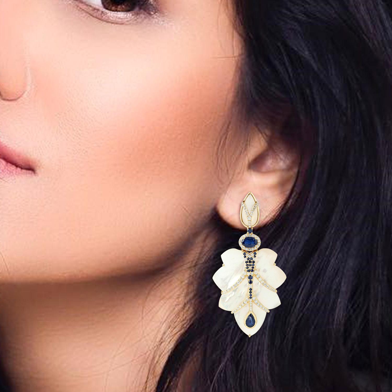 This fancy leaf shape Mother-Of-Pearl earring with diamond and sapphire is simply gorgeous. You can wear this on a formal and for a casual affair too. This earring can be worn easily and has push and post.

18KT: 12.284g
Diamond: 1.04ct
MOP:
