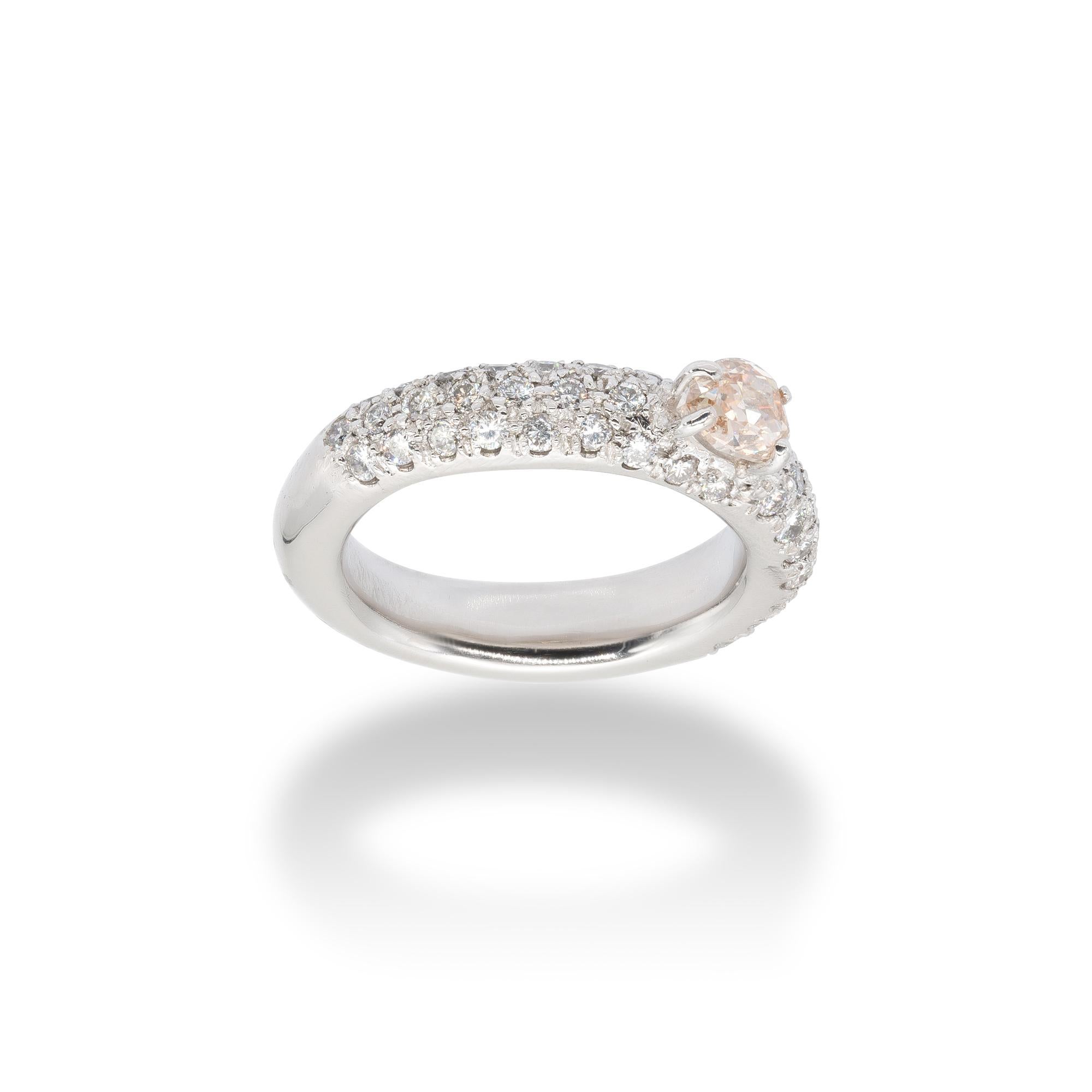 d'Avossa Sunshine Collection's Ring, 18Kt white gold with a pavé of 1.01 cts white G colour diamonds and a central 0.65 cts Fancy Natural pear-shaped Diamond.
This Ring has been designed to be worn alone, perhaps as an engagement ring, or together