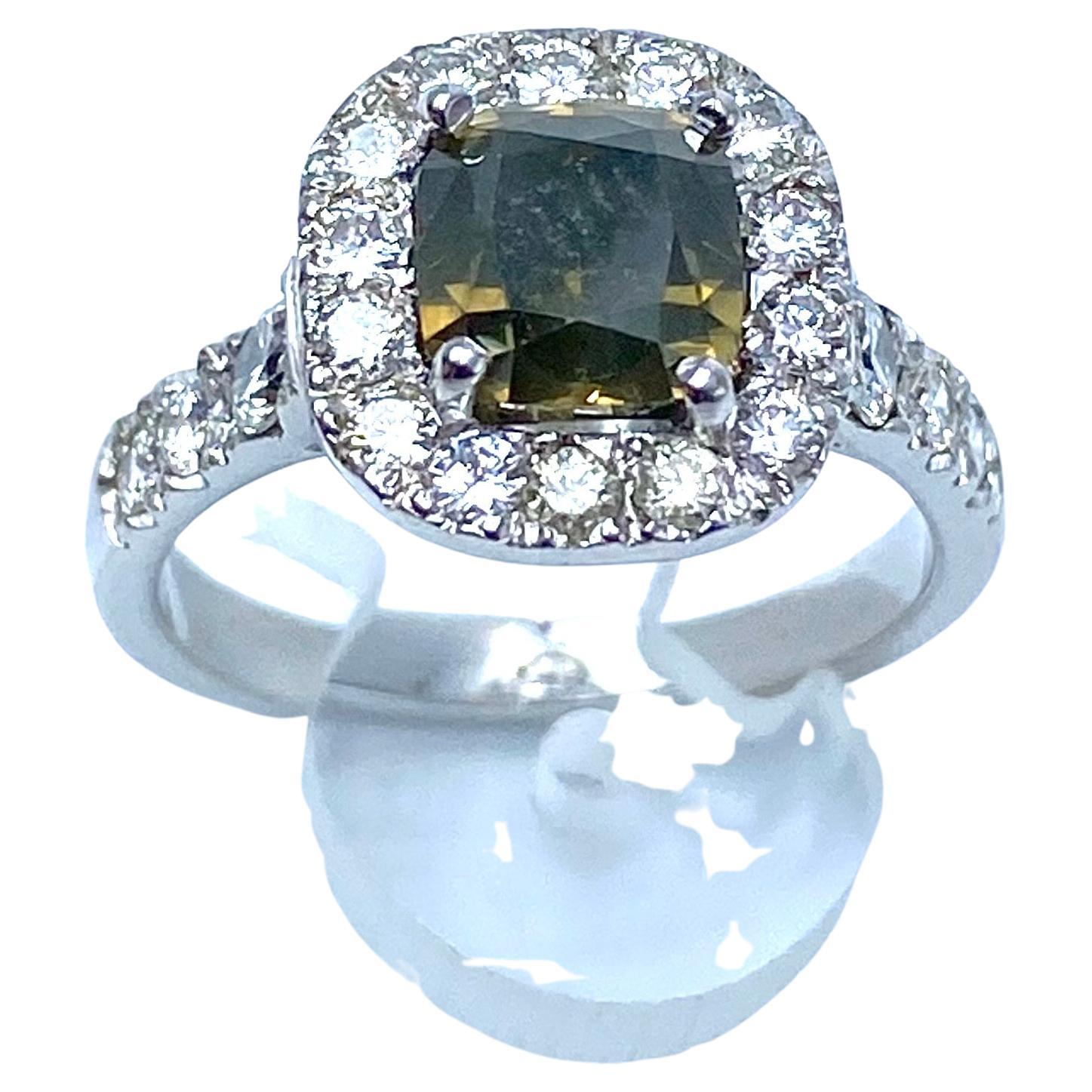 Refined ring bearing a fancy natural diamond described in the certificate GIL DIA201709093739
Size: 6.46 x 6.22 x 5.43 mm
Clarity: SI1
Treatment: untreated
Carats: 2.14 ct
Color: natural yellowish dark fancy green
Cutting pillow
Origin