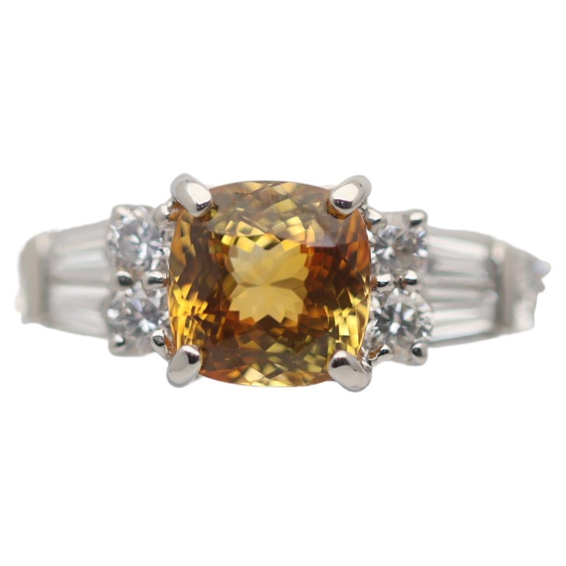 Platinring mit ausgefallenem orange-gelbem Saphir und Diamant