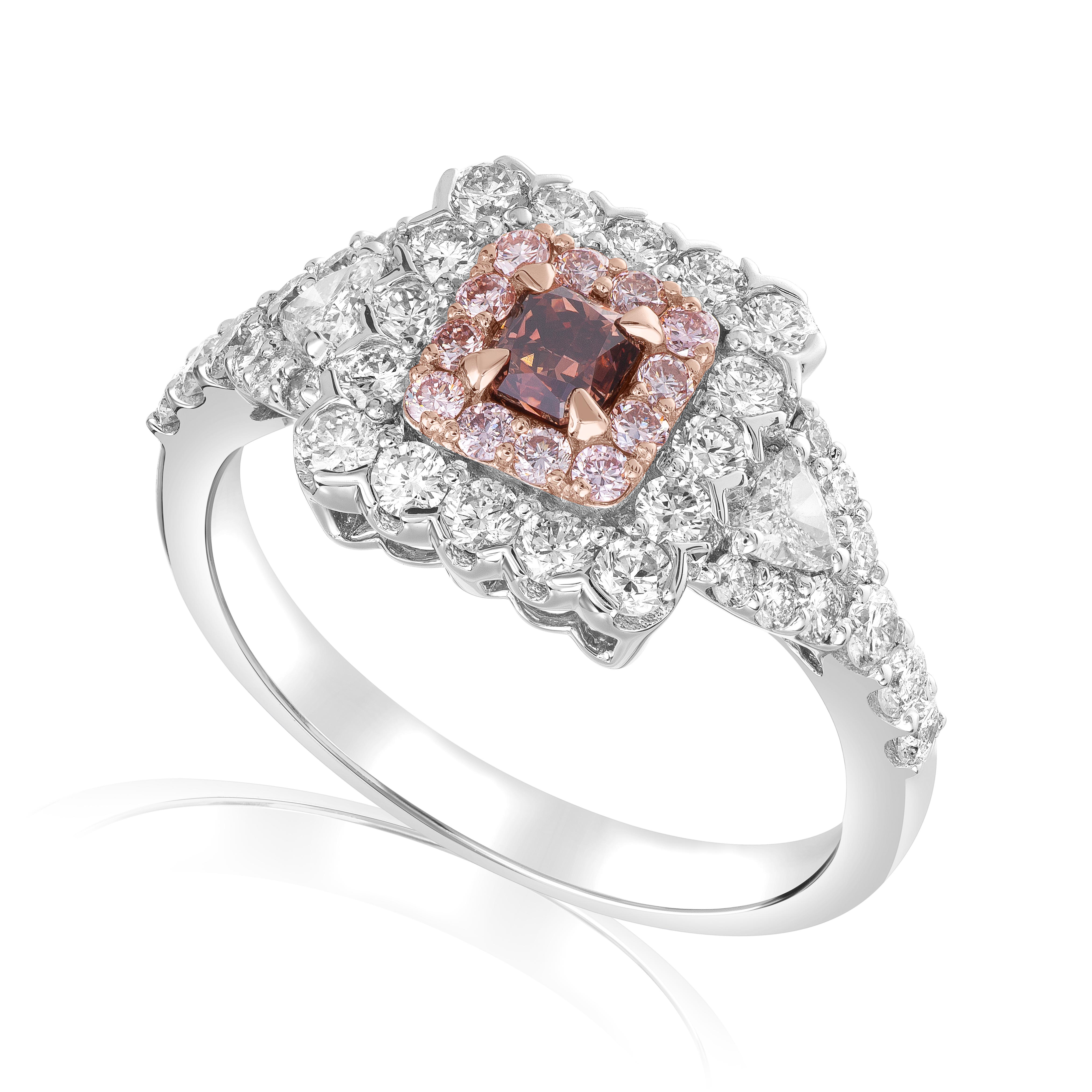 Celebrate your love with this extraordinary fancy-color engagement ring that is as unique as your relationship. The centerpiece of this captivating ring is a stunning 0.23-carat fancy orangy brown radiant diamond with VS2 clarity, creating a warm