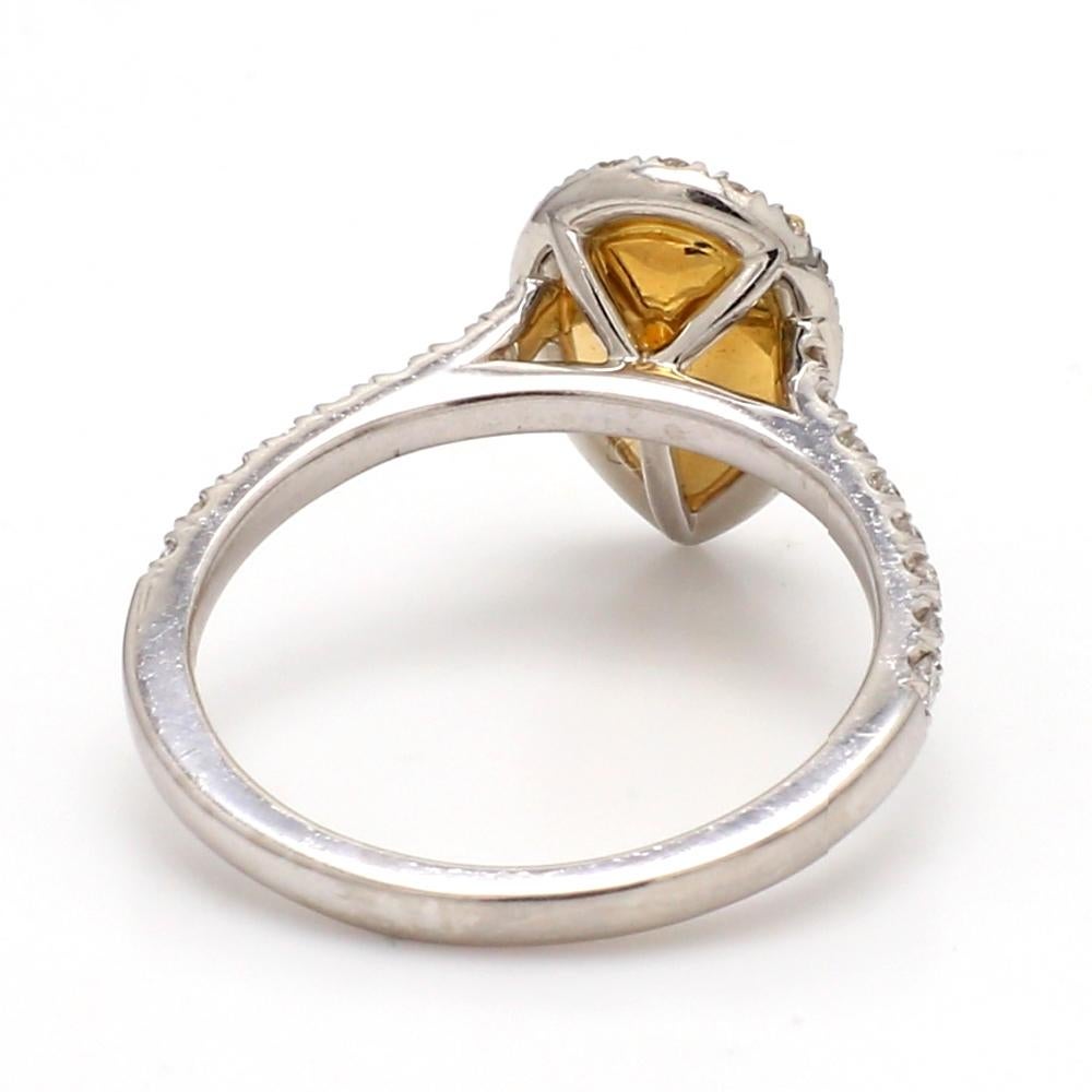 Pear Cut Fancy Orangy Yellow Diamond Ring with Round Diamond Accents For Sale