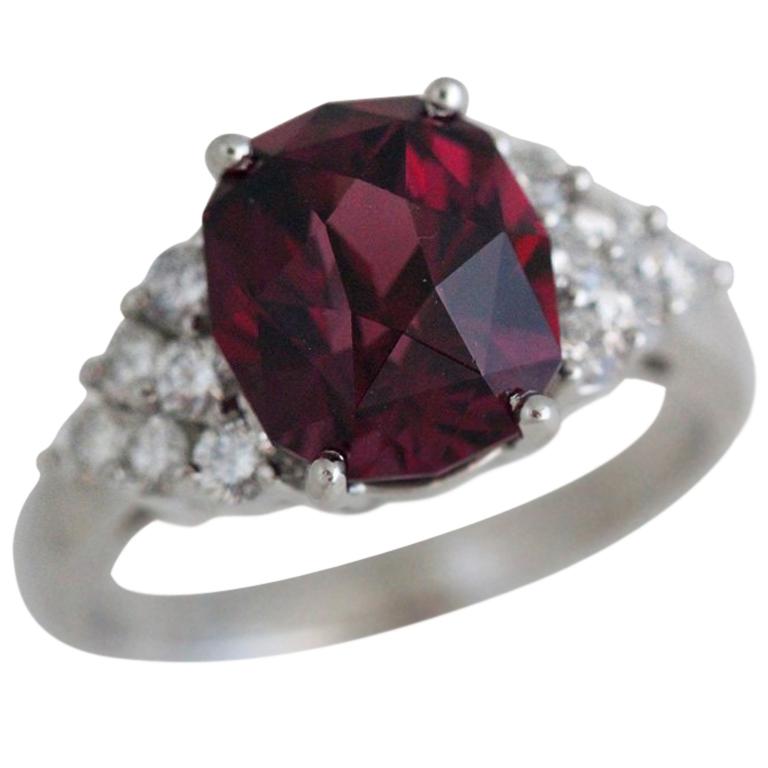 Fancy Oval Rhodolite Garnet Ring Set in Diamond and Platinum For Sale