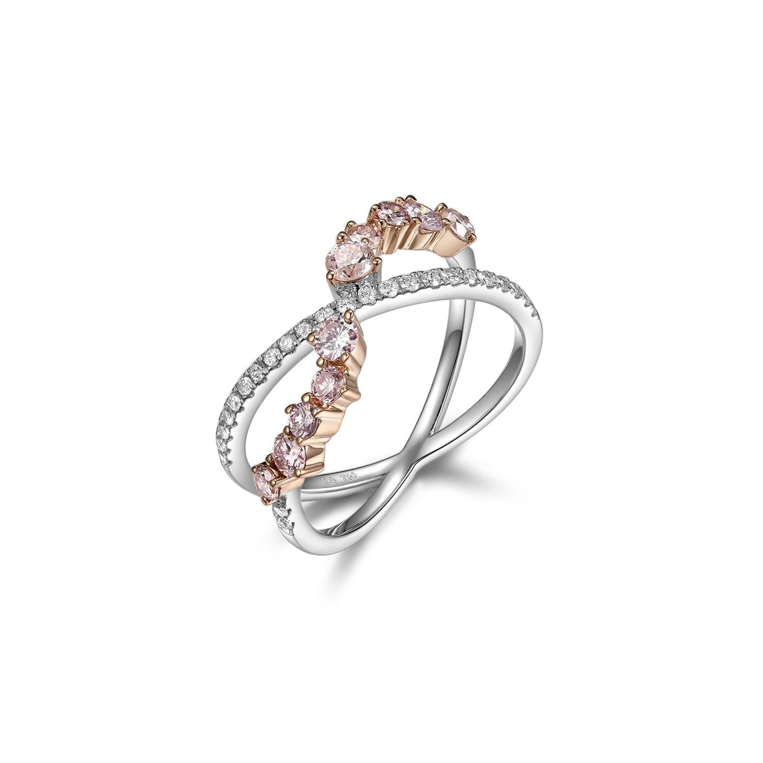 Introducing a work of art and elegance: a stunning cluster ring meticulously hand-set in a blend of 18 karat rose and white gold. This piece boasts the allure of Fancy Pink diamonds, a true testament to nature's grandeur. A total of 10 pink
