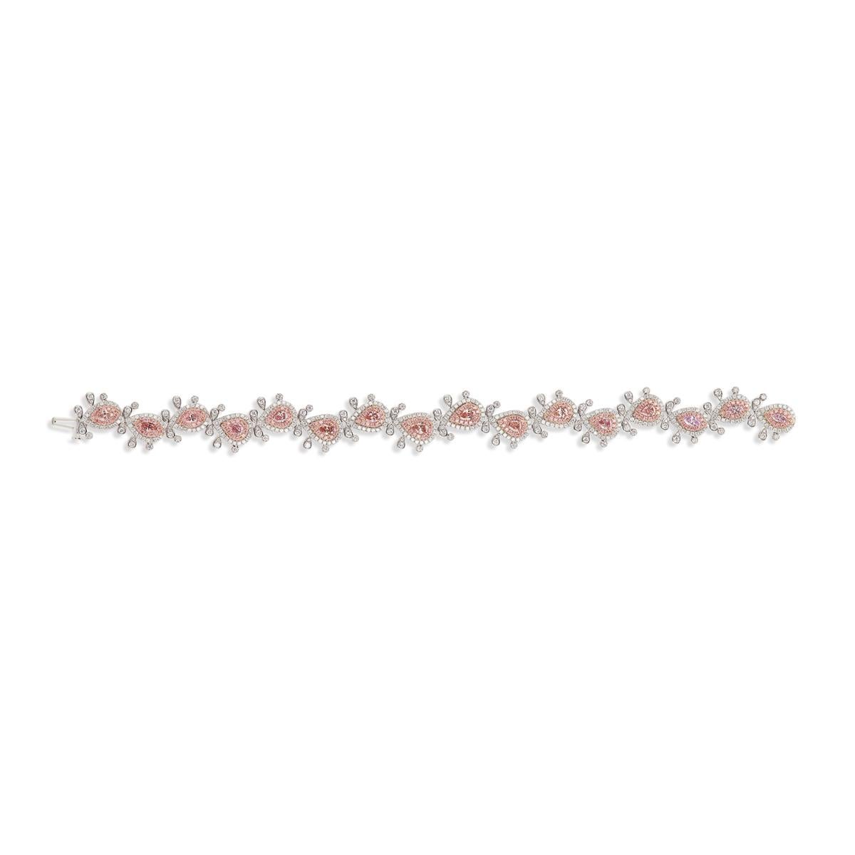 The Fancy Pink Diamond Bracelet  Has A Fancy Pink Diamond 10 Piece of Pear Shape  & 6 Piece Marquise total of 2.20 cts  Diamond Pink melee 200 Piece 0.92 cts And White 454 Piece 2.04 cts.  Total of 5.81 cts 
There Are 2 Pink Diamond Are Randomly